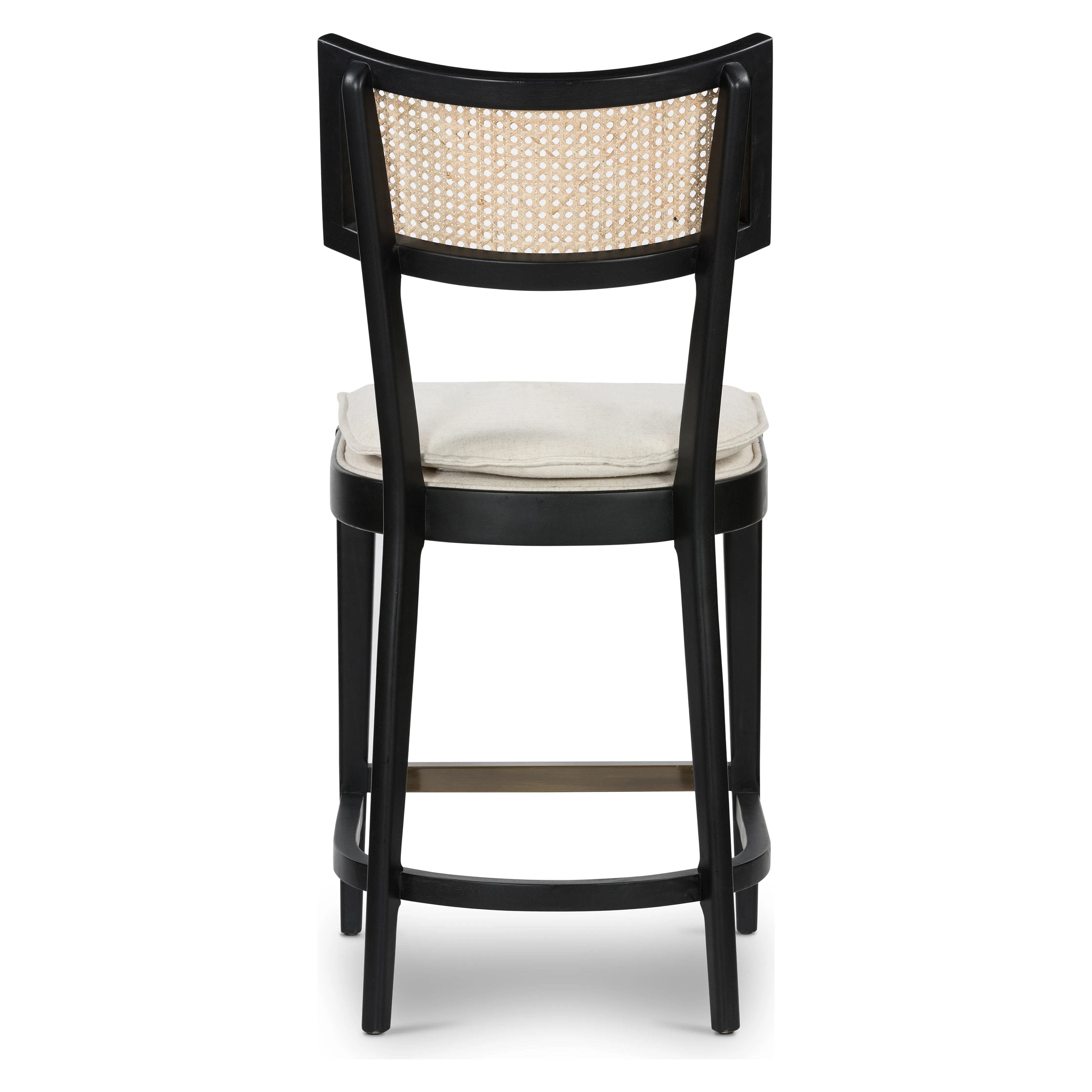 Featuring Britt Brushed Ebony with Savile Flax Stool by Four Hands at Amethyst Home. Mixed materials refresh retro styling. Brushed ebony nettlewood frames a textural inlay of natural cane for beautifully crisp contrast. Fastened by Velcro, light, linen-blend seating of high-performance fabric brings modern sensibility to the counter. Performance fabrics are s. Amethyst Home provides interior design, new home construction design consulting, vintage area rugs, and lighting in the Austin metro area.