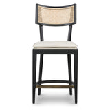 Featuring Britt Brushed Ebony with Savile Flax Stool by Four Hands at Amethyst Home. Mixed materials refresh retro styling. Brushed ebony nettlewood frames a textural inlay of natural cane for beautifully crisp contrast. Fastened by Velcro, light, linen-blend seating of high-performance fabric brings modern sensibility to the counter. Performance fabric. Amethyst Home provides interior design, new home construction design consulting, vintage area rugs, and lighting in the Winter Garden metro area.