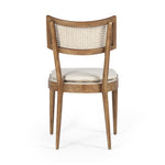 Featuring Britt Toasted Nettlewood Dining Chair by Four Hands at Amethyst Home. Mixed materials refresh retro dining style. Light-toasted nettlewood frames a textural inlay of natural cane, for perfect contrast. Fastened by Velcro, high-performance linen-blend seating for modern sensibility. Performance fabrics are specially created to withstand spills, stain. Amethyst Home provides interior design, new home construction design consulting, vintage area rugs, and lighting in the Houston metro area.