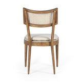 Featuring Britt Toasted Nettlewood Dining Chair by Four Hands at Amethyst Home. Mixed materials refresh retro dining style. Light-toasted nettlewood frames a textural inlay of natural cane, for perfect contrast. Fastened by Velcro, high-performance linen-blend seating for modern sensibility. Performance fabrics are specially created to withstand spills, stain. Amethyst Home provides interior design, new home construction design consulting, vintage area rugs, and lighting in the Houston metro area.