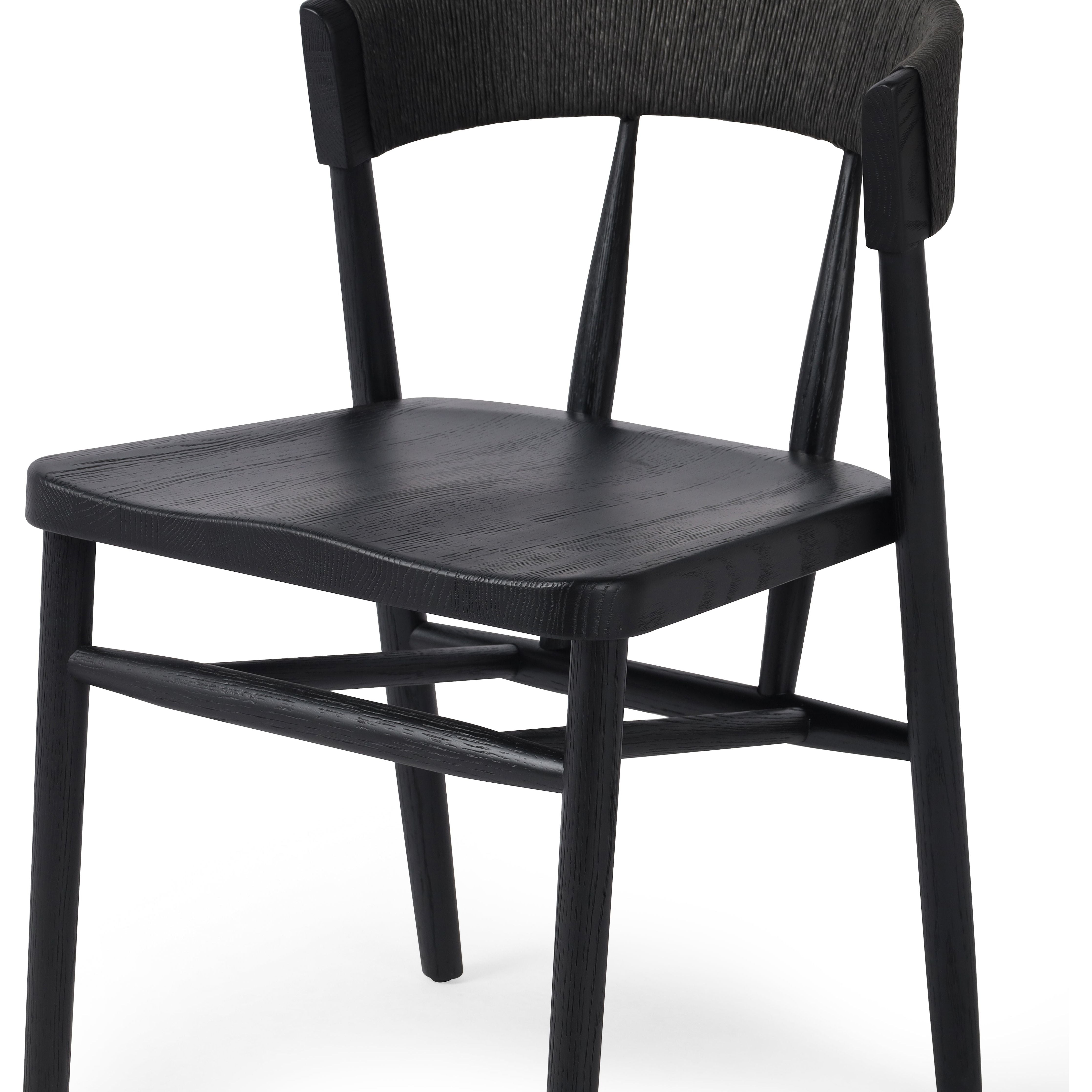 Featuring Buxton Black Oak Dining Chair by Four Hands at Amethyst Home. A solid oak dining chair defined by tapered legs and