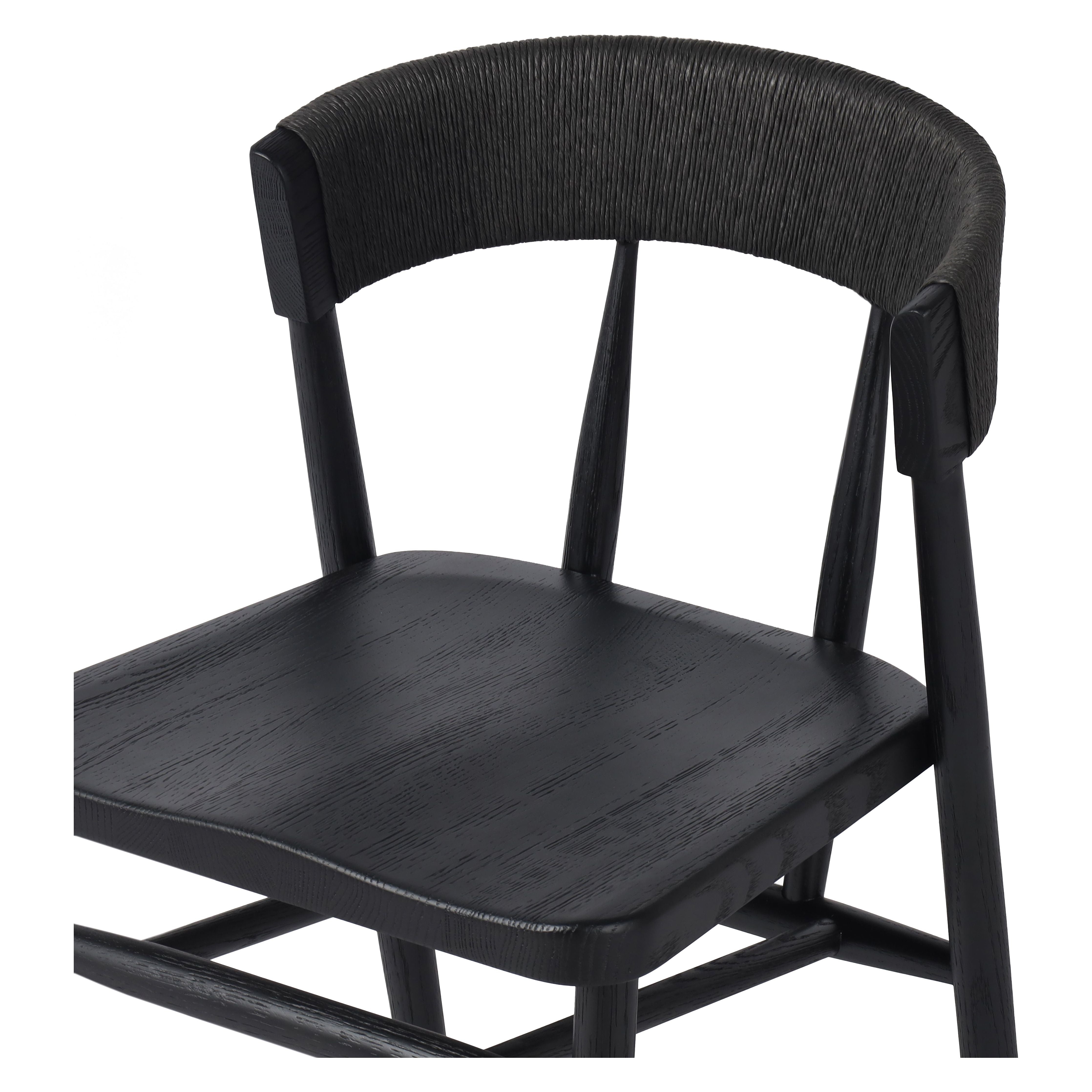 Featuring Buxton Black Oak Dining Chair by Four Hands at Amethyst Home. A solid oak dining chair defined by tapered legs and