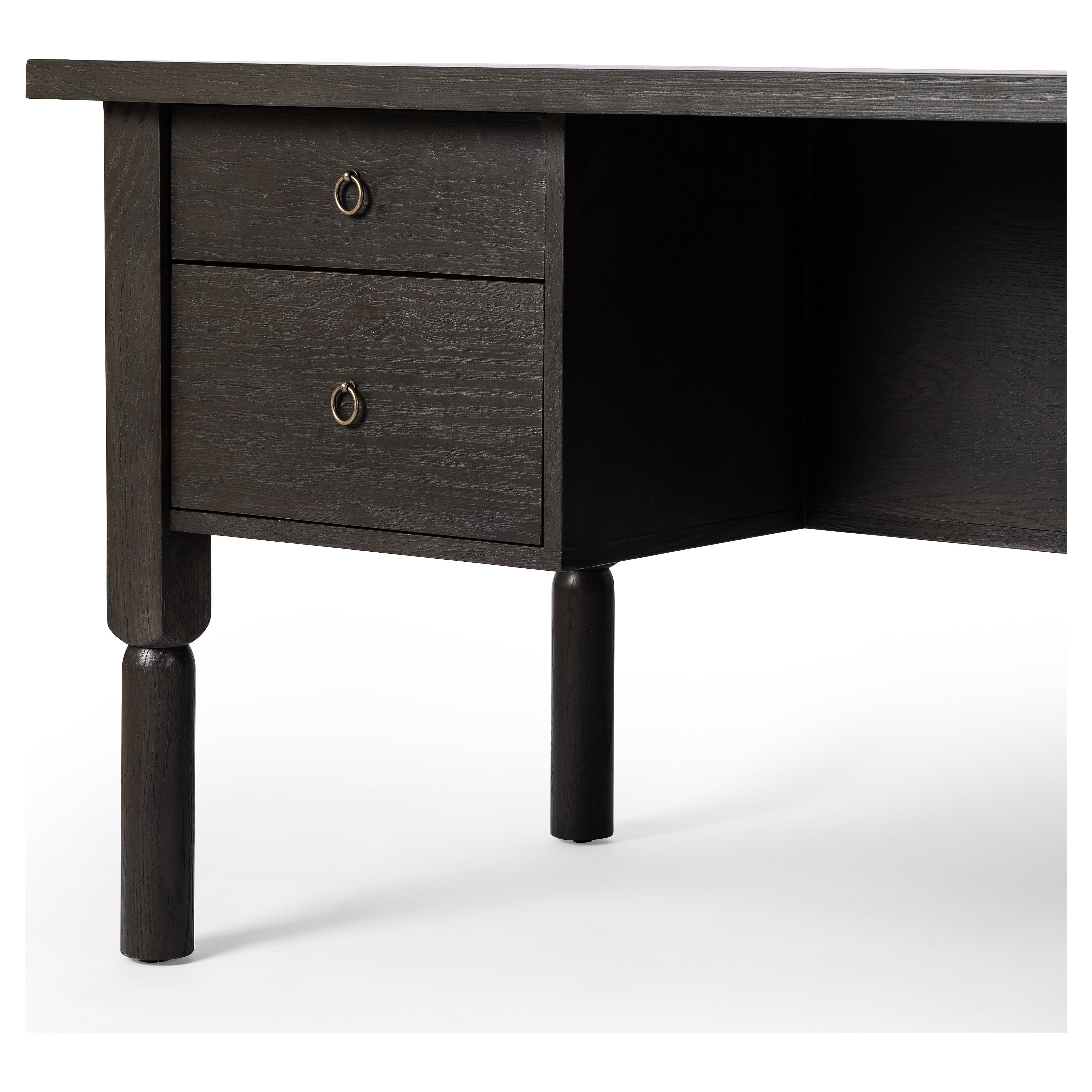 Featuring Concord Charcoal Oak Desk by Four Hands at Amethyst Home. Made from oak veneer with a deep charcoal finish, this executive-size desk delivers ultimate storage, including four drawers on one side plus six open cubbies on the other, granting the option to float-style in a room. Partially turned legs add a design-forward finishing touch.Overall Dimensions: 75"W x 30"L x 30"H
. Amethyst Home provides interior design, new construction, custom furniture, and area rugs in the Dallas metro area.