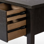 Featuring Concord Charcoal Oak Desk by Four Hands at Amethyst Home. Made from oak veneer with a deep charcoal finish, this executive-size desk delivers ultimate storage, including four drawers on one side plus six open cubbies on the other, granting the option to float-style in a room. Partially turned legs add a design-forward finishing touch.Overall Dimensions: 75"W x 30"L . Amethyst Home provides interior design, new construction, custom furniture, and area rugs in the Newport Beach metro area.