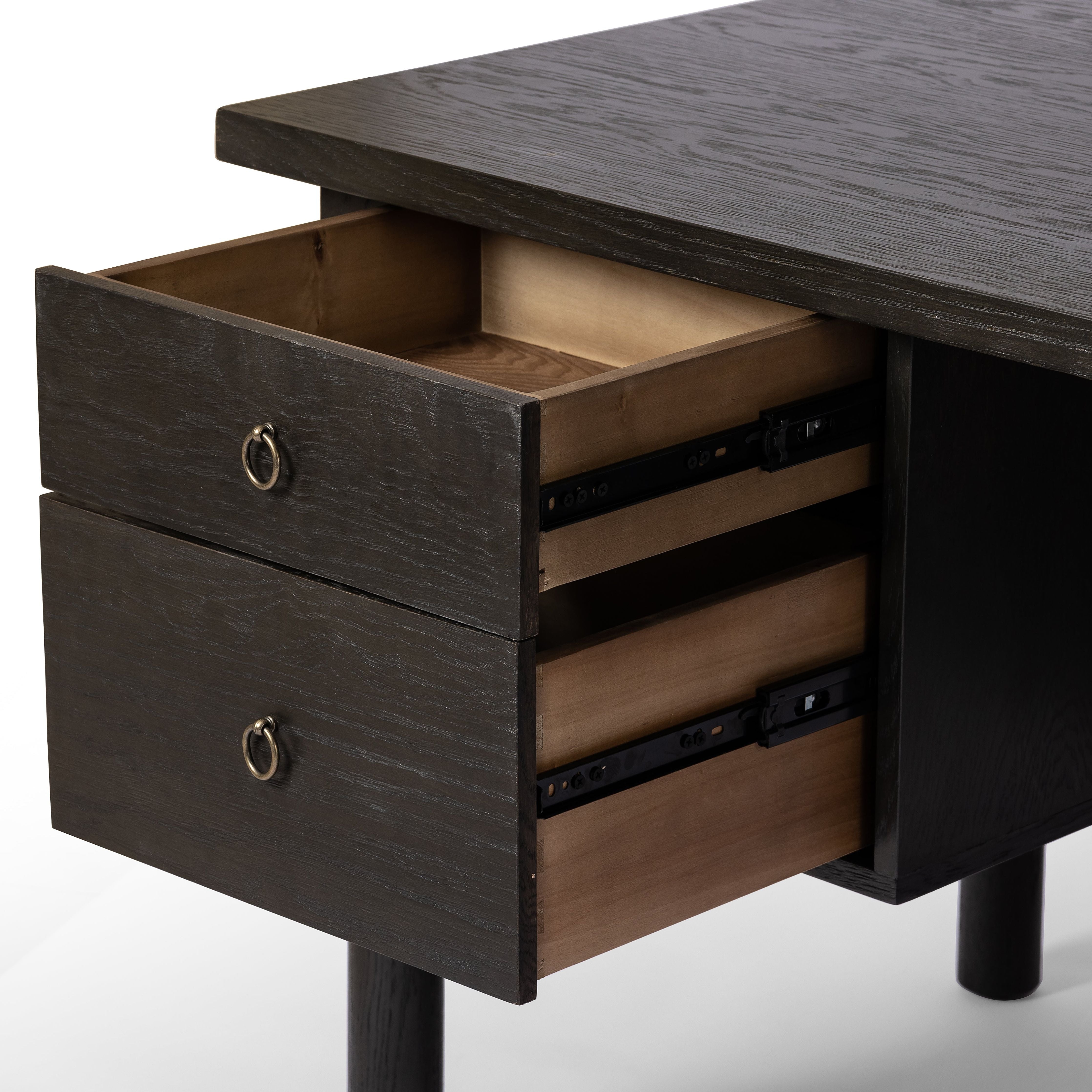 Featuring Concord Charcoal Oak Desk by Four Hands at Amethyst Home. Made from oak veneer with a deep charcoal finish, this executive-size desk delivers ultimate storage, including four drawers on one side plus six open cubbies on the other, granting the option to float-style in a room. Partially turned legs add a design-forward finishing touch.Overall Dimensions: 75"W x 30"L x 30"H
C. Amethyst Home provides interior design, new construction, custom furniture, and area rugs in the Omaha metro area.