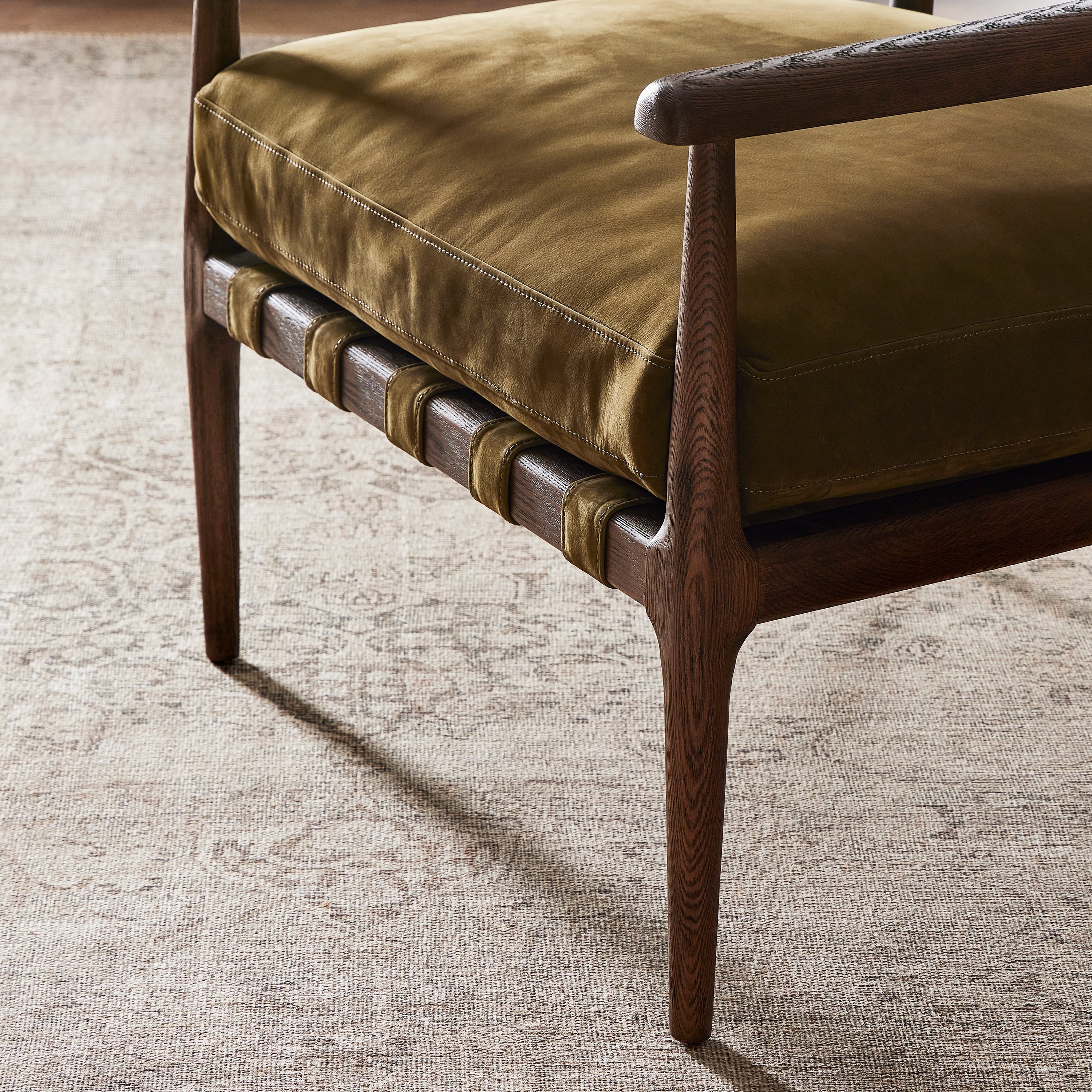 Featuring Dane Cottswald Moss Nubuck Chair by Four Hands at Amethyst Home. Safari styling is brought to modern speed on this vintage-inspired chair. Its solid wood frame features a webbed seating structure that brings a sink-in feel to the entire piece. The upholstered back, strap details and loose cushion are finished in a rich Italian-made leather with a soft, buttery feel an. Amethyst Home provides interior design, new construction, custom furniture, and area rugs in the Los Angeles metro area.