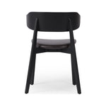 Featuring Franco Sonoma Black Upholstered Dining Chair by Four Hands at Amethyst Home. A fresh, exaggerated take on the wing-back dining chair. Finished a classic jet black, a mix of solid ash and ash veneer makes a modern and shapely seating statement with midcentury undertones. Complemented by a cushioned seat in black top-grain leather exclusive to Four Hands.Overall Dimensions: . Amethyst Home provides interior design, new construction, custom furniture, and area rugs in the Austin metro area.