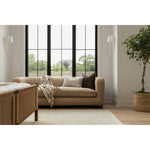 The Gidget Sheepskin Camel Sofa is a stylish and comfortable addition to any home. The bench-seat cushioning and feather-blend seating ensure total comfort for lounging and relaxing. This piece can be paired with a variety of home decor styles, from modern coastal to traditional. Perfectly complemented by white plaster lighting and a Turkish oushak rug. Ideal for Nashville, Florida, and Utah home designs.
