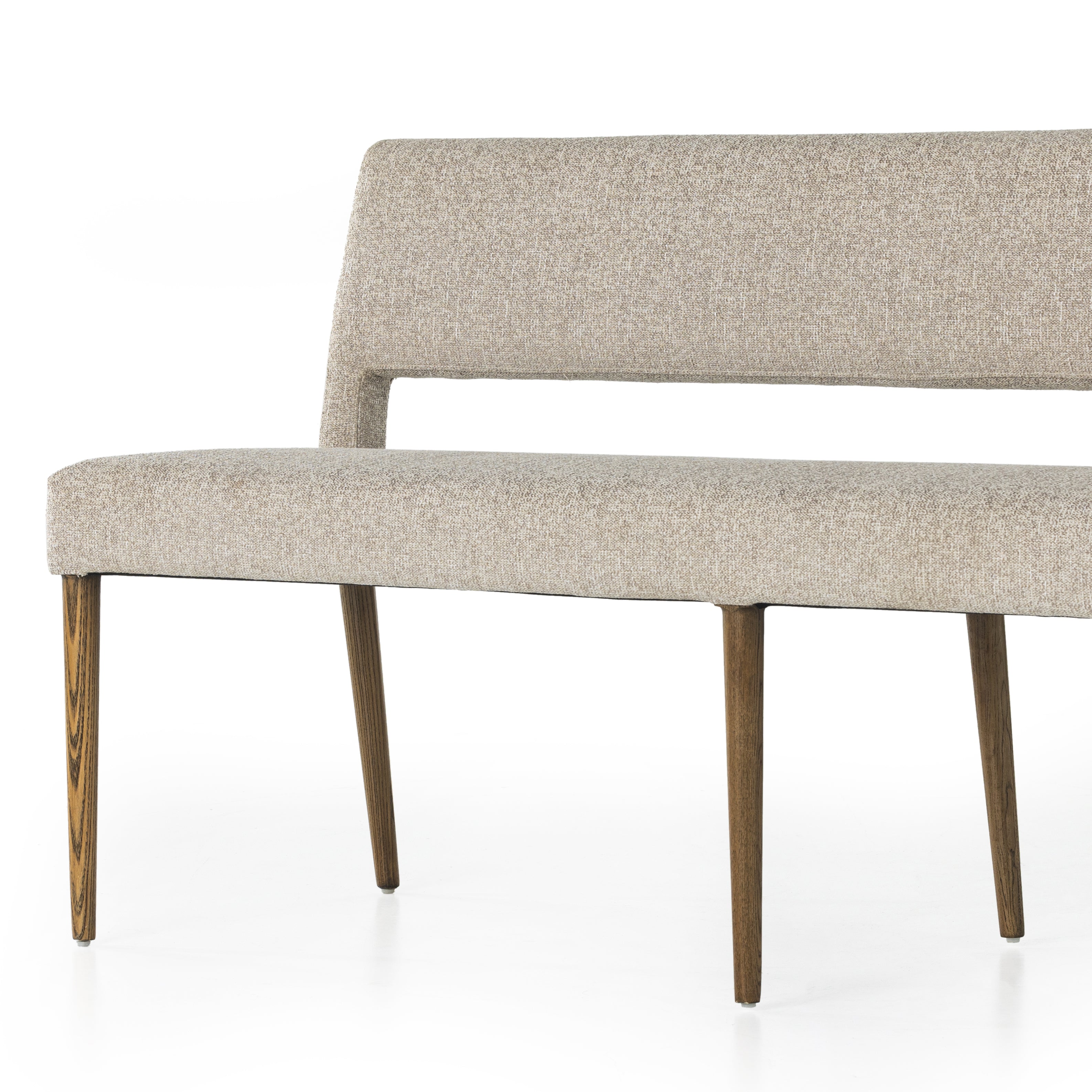 Featuring Joseph Light Camel Dining Bench by Four Hands at Amethyst Home. Simply styled and midcentury-minded, Joseph Light Camel Dining Bench is a textural light taupe upholstery that features a posterior cutout for added flair, with toasted nettlewood legs for natural contrast.
Overall Dimensions: 65"W x 22.75"L x 32"HWeight: 38.34 lbsMaterials: 100% Polyester, Solid Nettlewood. Amethyst Home provides interior design services, furniture, rugs, and lighting in the Dallas metro area.