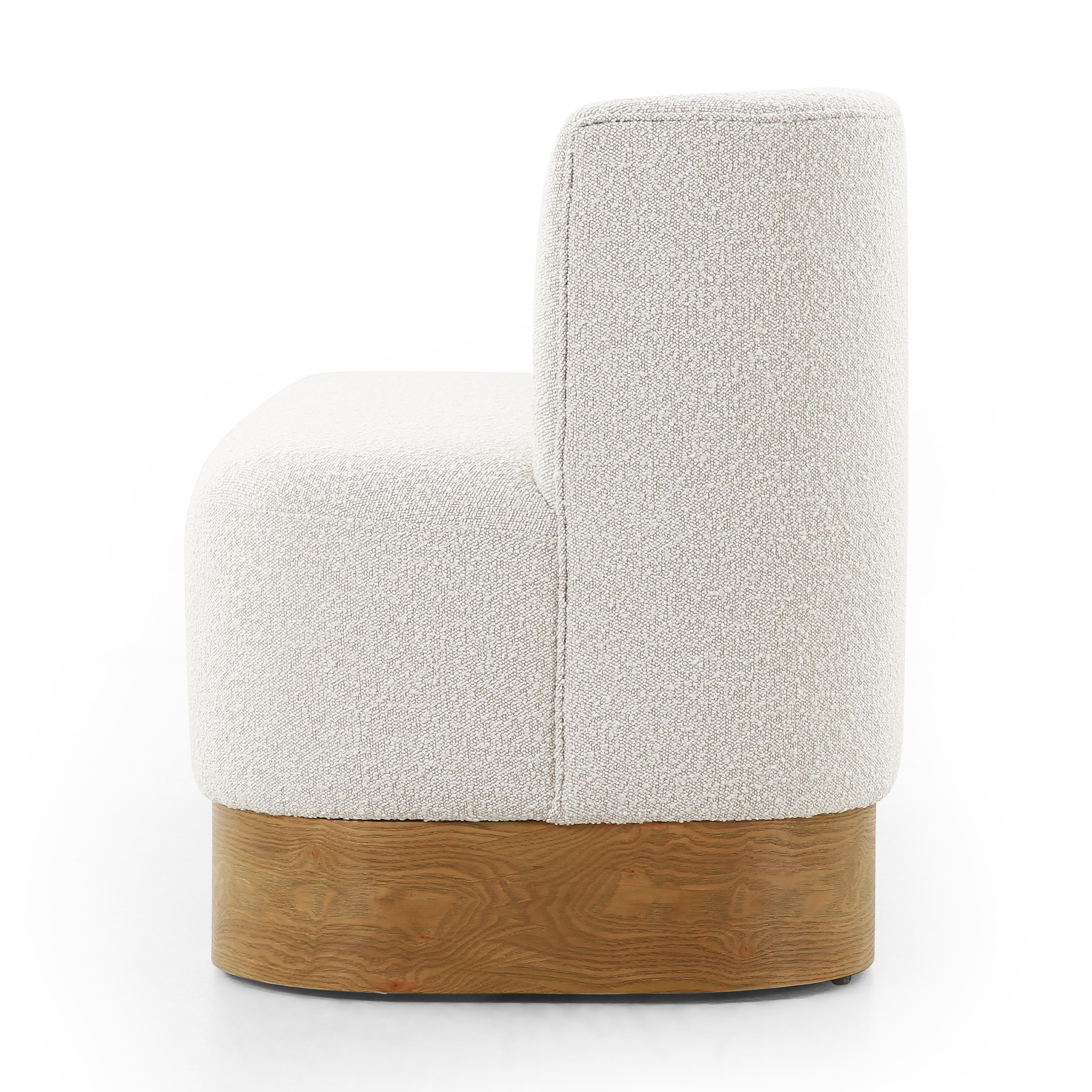 Featuring Krista Knoll Natural Dining Bench by Four Hands at Amethyst Home. Style takes shape. Comfortably curved bench seating is upholstered in a chunky off-white boucle, with water-repellent performance fabric for a modern touch. A plinth-style ash veneer base works casual contrast into the mix. Perfectly sized for a cozy breakfast nook; pair up to suit . Amethyst Home provides interior design, new home construction design consulting, vintage area rugs, and lighting in the Park City metro area.
