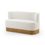 Featuring Krista Knoll Natural Dining Bench by Four Hands at Amethyst Home. Style takes shape. Comfortably curved bench seating is upholstered in a chunky off-white boucle, with water-repellent performance fabric for a modern touch. A plinth-style ash veneer base works casual contrast into the mix. Perfectly sized for a cozy breakfast nook; pair up to suit a. Amethyst Home provides interior design, new home construction design consulting, vintage area rugs, and lighting in the Portland metro area.