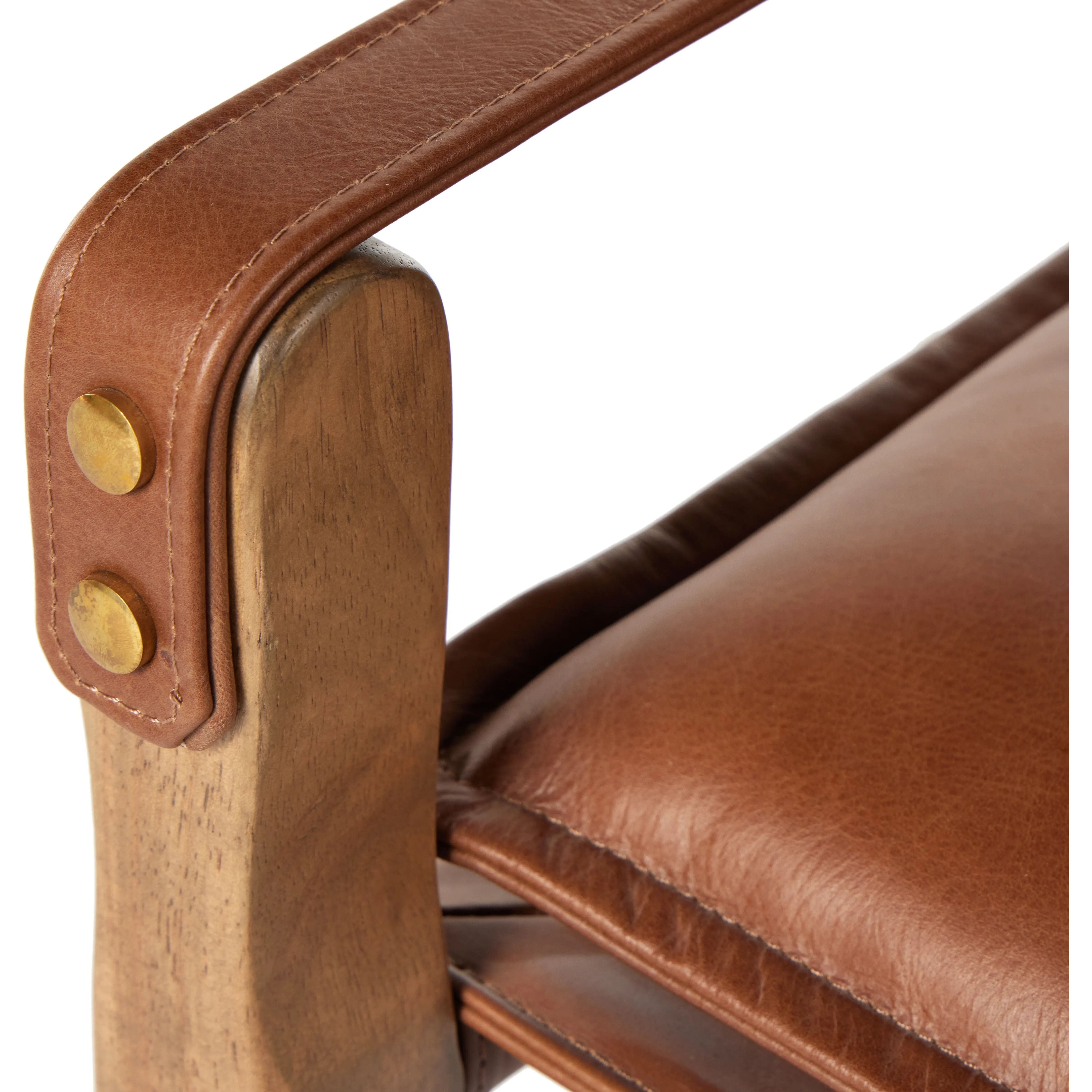 Featuring Lenz Sonoma Chestnut Dining Armchair by Four Hands at Amethyst Home. Inspired by a vintage safari-style frame, this dining chair is defined by the fluid strap arms. Semi-attached cushions in rich chestnut leather, finished with button tufting details. Parawood frame and brass details add warmth and texture.Overall Dimensions: 25"W x 23"L x 34"H. Amethyst Home provides interior design, new home construction design consulting, vintage area rugs, and lighting in the Laguna Beach metro area.