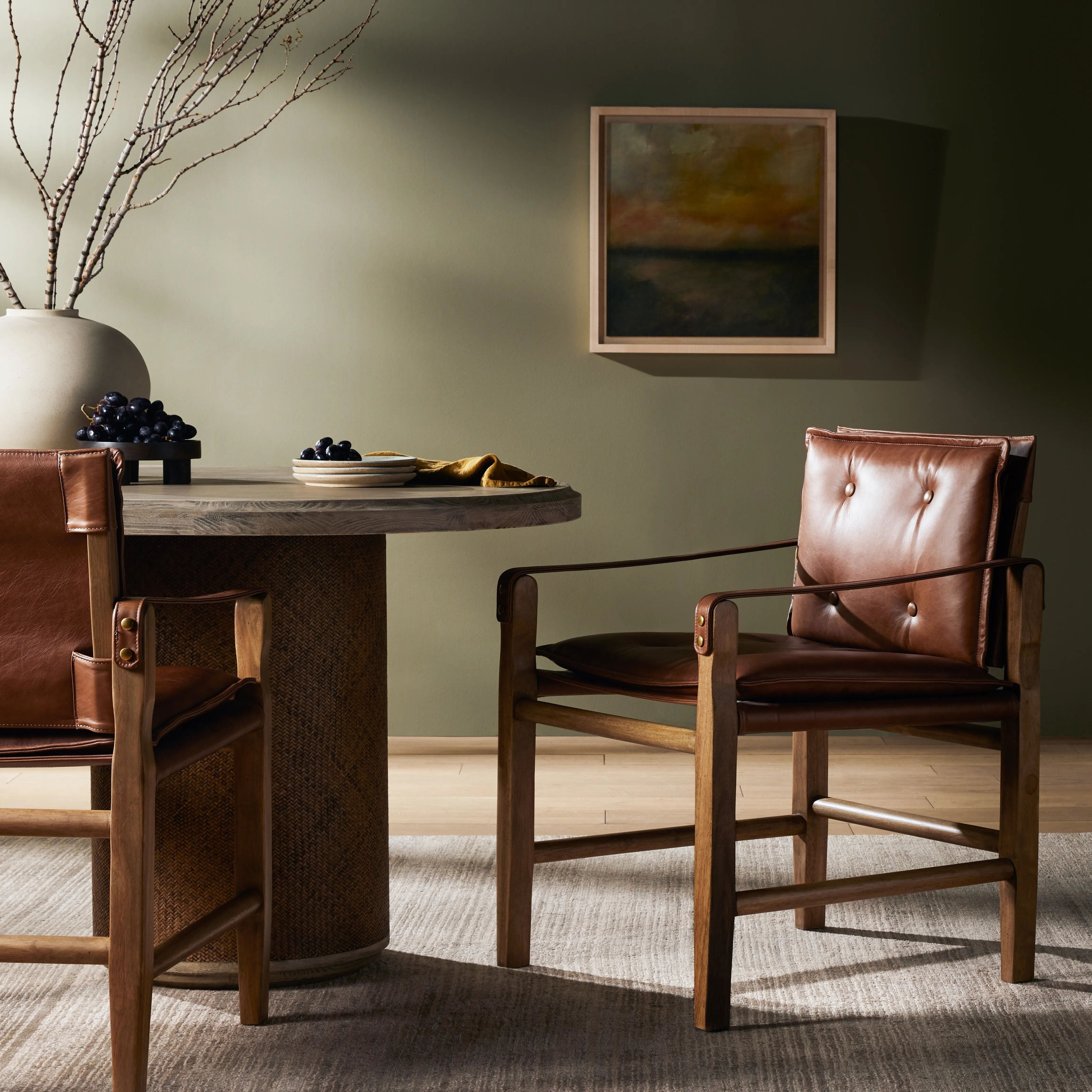 Featuring Lenz Sonoma Chestnut Dining Armchair by Four Hands at Amethyst Home. Inspired by a vintage safari-style frame, this dining chair is defined by the fluid strap arms. Semi-attached cushions in rich chestnut leather, finished with button tufting details. Parawood frame and brass details add warmth and texture.Overall Dimensions: 25"W x 23"L x 34"H
. Amethyst Home provides interior design, new home construction design consulting, vintage area rugs, and lighting in the Los Angeles metro area.