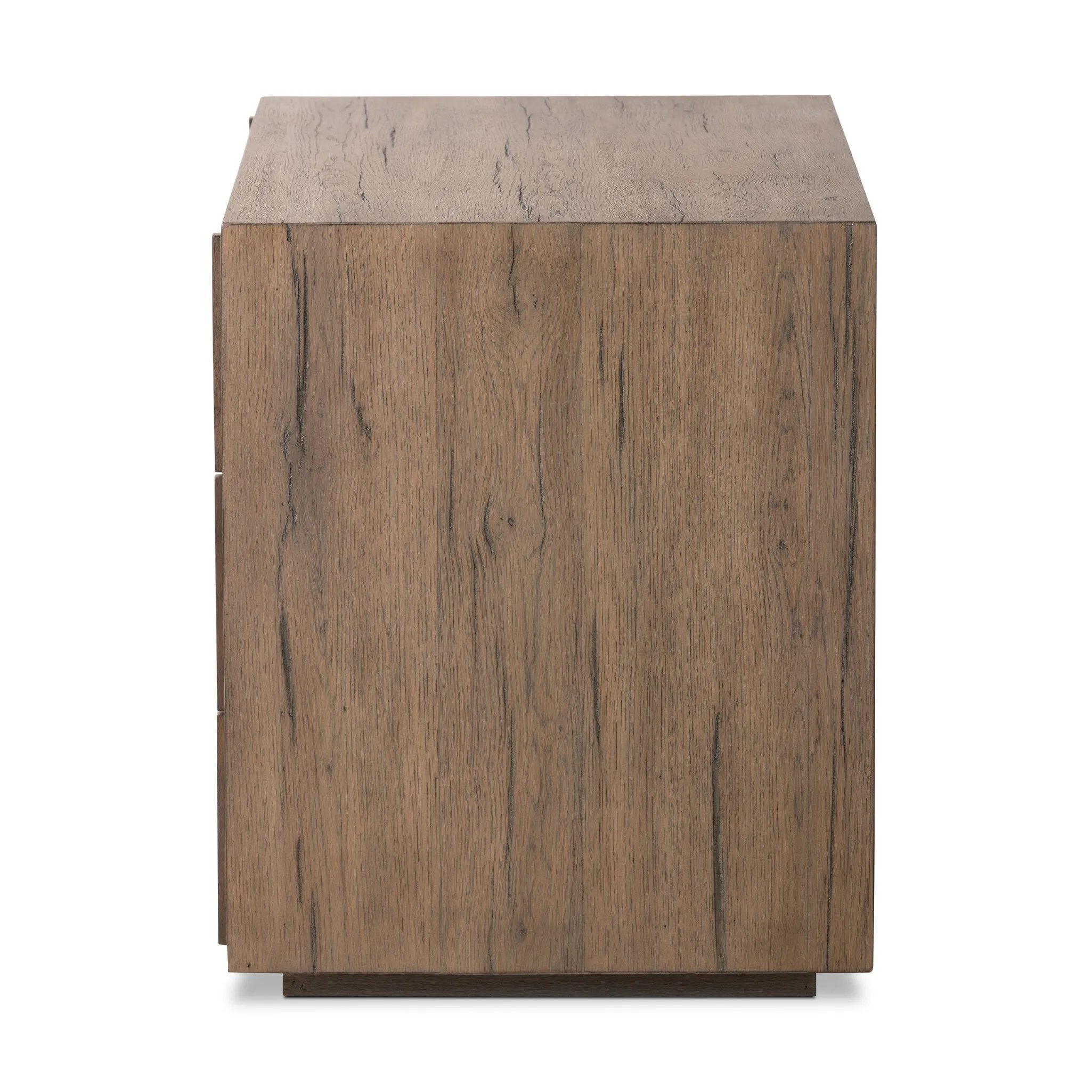 Featuring Leo Rustic Grey Nightstand by Four Hands at Amethyst Home. Designed by Thomas Bina and Ronald Sasson, a design partnership blending both modern minimalist and Brazilian influences. Crafted from solid oak, this clean-lined nightstand features vertical reed detailing on the drawer fronts with wooden pull detailing on the outer edges. Drawers are finis. Amethyst Home provides interior design, new home construction design consulting, vintage area rugs, and lighting in the Houston metro area.