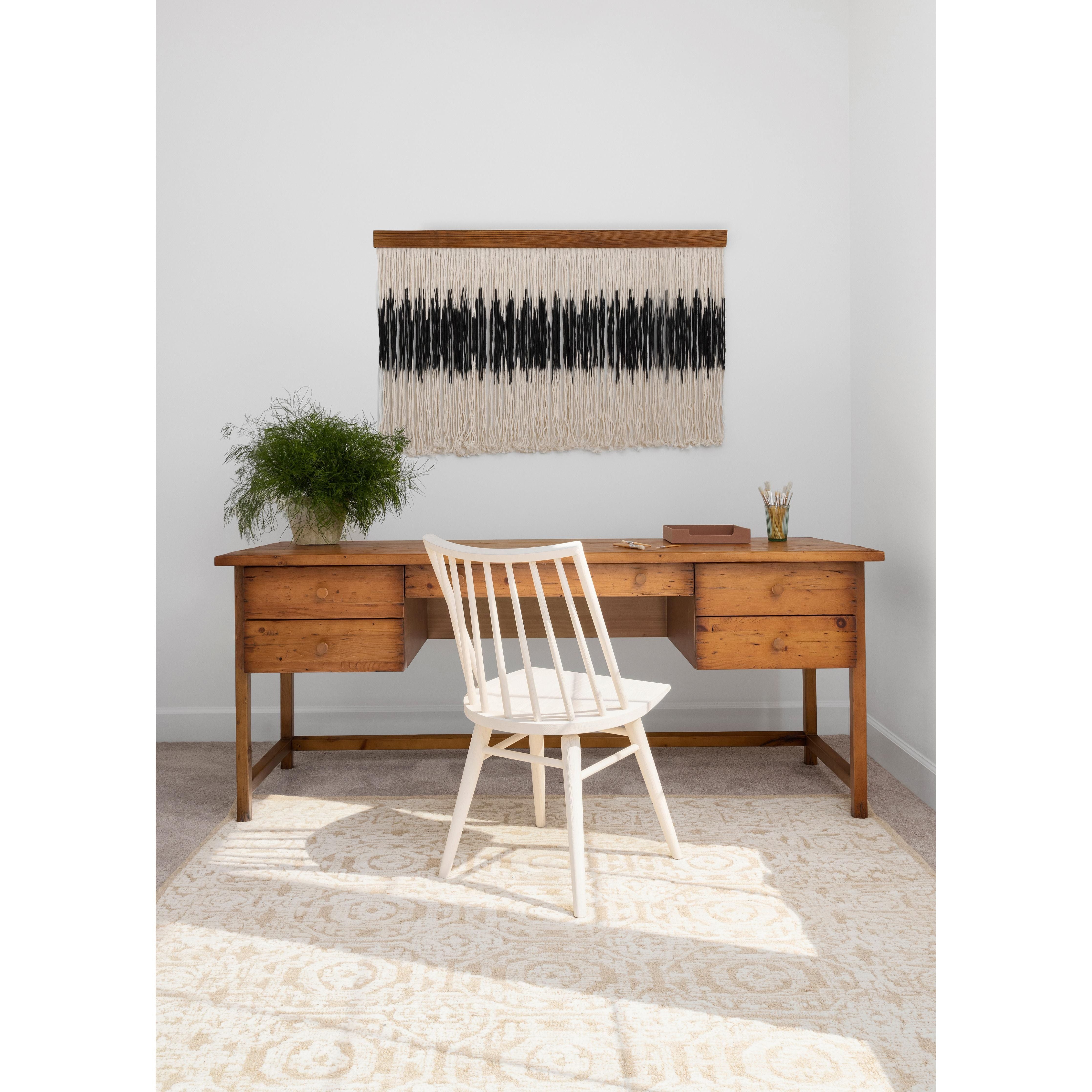 Featuring Lewis Windsor Chair by Four Hands at Amethyst Home. Try a cleaner, more contemporary take on the traditional Windsor. Tall oak seating is wire-brushed to bring out natural cathedral graining, then stained to a beautifully neutral off-white.
Overall Dimensions: 18.5"W x 20.5"L x 32.75"HColors: Off White Oak SolidMaterials: Solid OakWeight: 14.0.  Amethyst Home provides interior design, new home construction design consulting, vintage area rugs, and lighting in the Des Moines metro area.