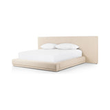 Featuring Martina Bergamo Extra Wide King Bed by Four Hands at Amethyst Home. Low profile luxury with an extra-wide fully upholstered headboard that brings drama to the bedroom. Modern Italian styling is both substantial and plush with clean lines all around. Fully upholstered in a textural cotton/linen blend with extra cushioning on the footboard and side rail. Amethyst Home provides interior design, new home construction design consulting, vintage area rugs, and lighting in the Tampa metro area.