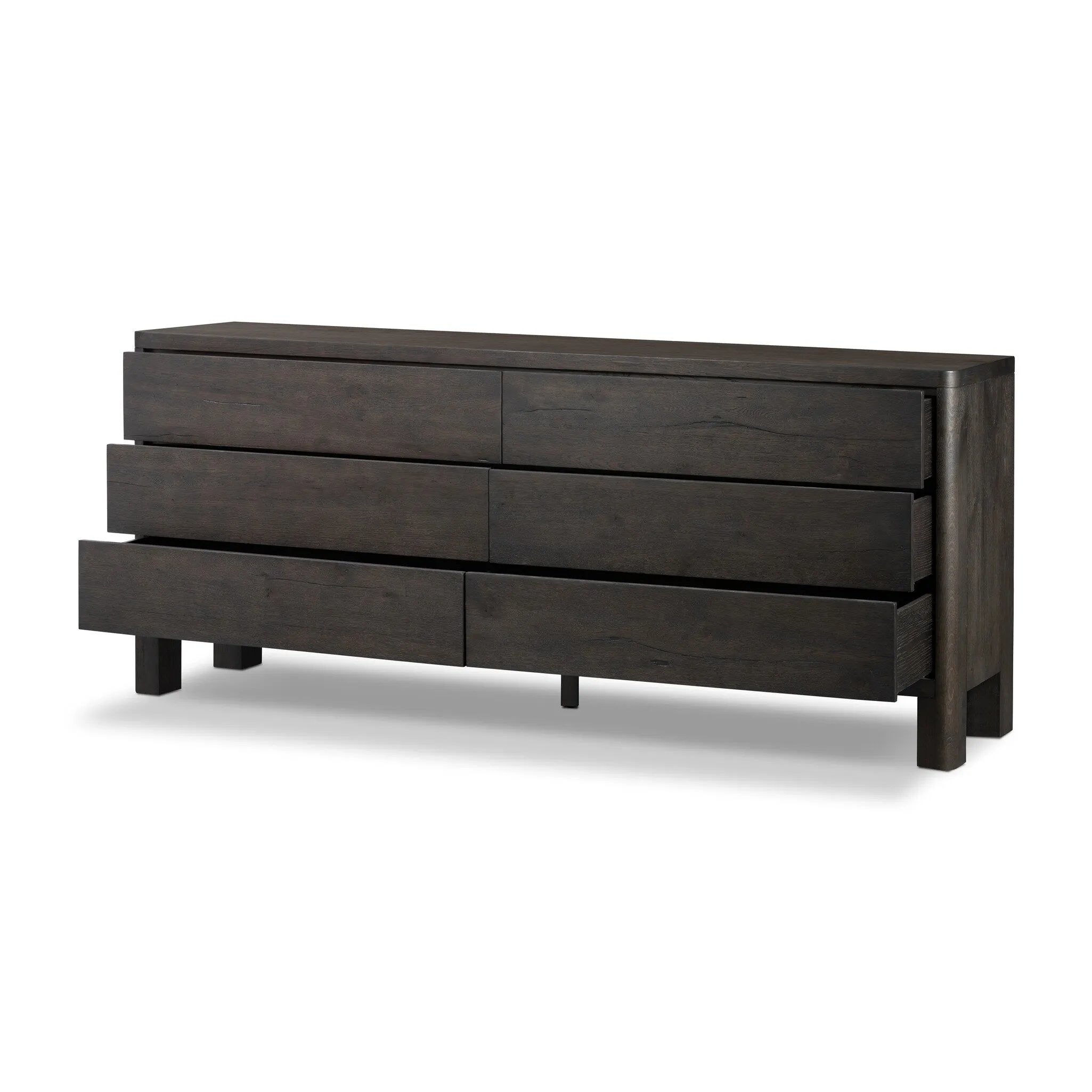 Featuring Noeline Smoked Black Oak Veneer 6 Drawer Dresser by Four Hands at Amethyst Home. Topped with a thick plank of solid oak, this extra-wide dresser blends modern lines and warm character with six roomy drawers, slightly curved corners, and solid square legs. Seamless drawer fronts have a push-latch mechanism. Made from solid oak and veneer in a smok. Amethyst Home provides interior design, new home construction design consulting, vintage area rugs, and lighting in the Washington metro area.