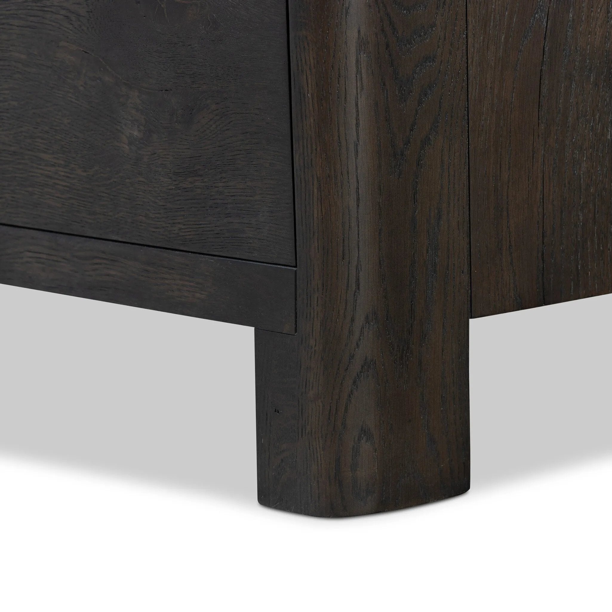 Featuring Noeline Smoked Black Oak Veneer Nightstand by Four Hands at Amethyst Home. Topped with a thick plank of solid oak, this extra-wide nightstand blends modern lines and warm character with two roomy drawers, slightly curved corners, and solid square legs. Seamless drawer fronts have a push-latch mechanism. Made from solid oak and veneer in a smoky. Amethyst Home provides interior design, new home construction design consulting, vintage area rugs, and lighting in the Laguna Beach metro area.