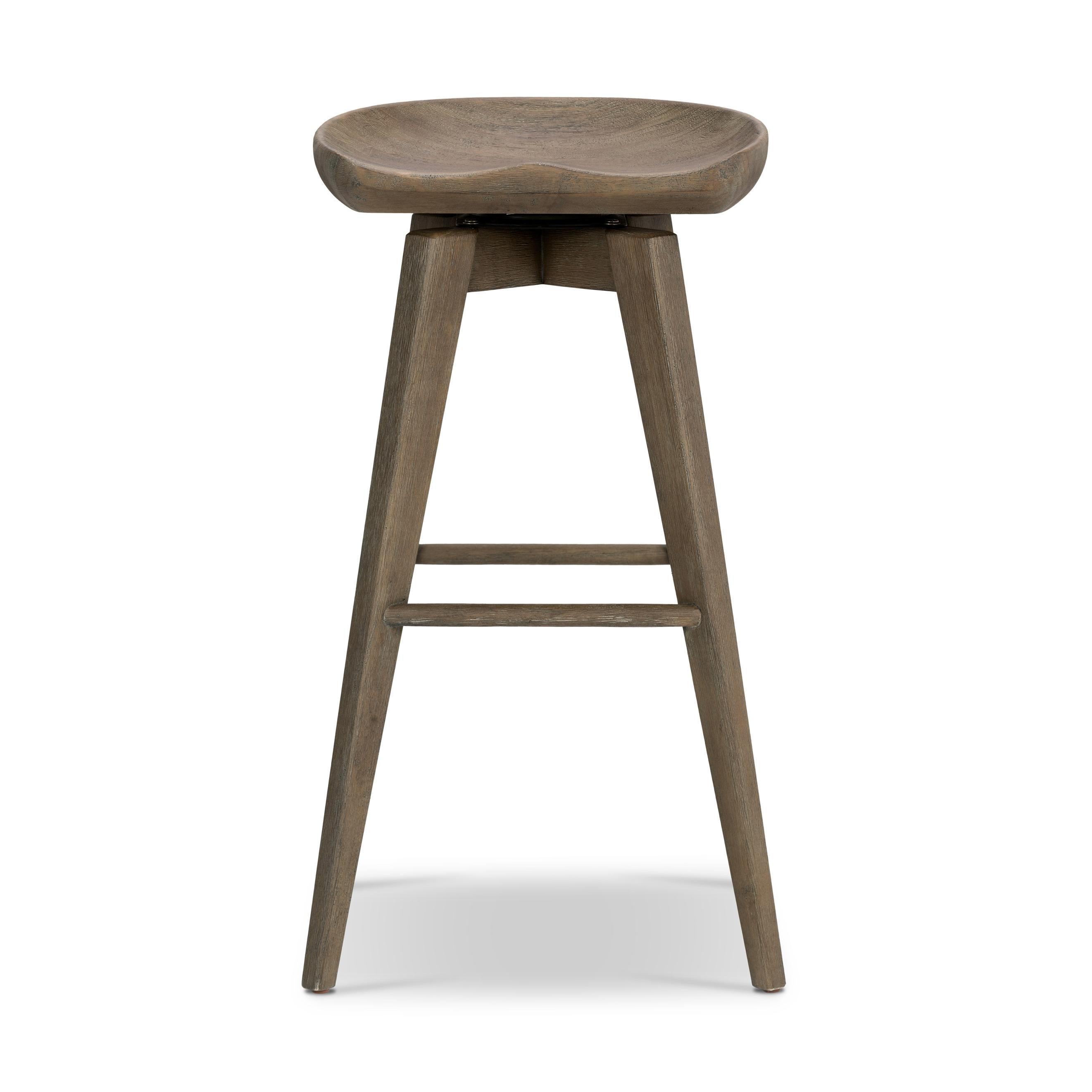 Featuring Paramore Swivel Stool by Four Hands at Amethyst Home. A fresh spin on bar seating, the parawood Paramore Swivel Stool is finished in a deep charcoal for a clean, sleek look. The stool is topped with a swivel.
Counter Stool Size: 16.25"W x 16.25"L x 26"HSeat Depth: 13.5"Seat Height: 24.75"
Bar Stool Size: 17.5"W x 17.5"L x 30.75"HSeat Depth: 13.5". Amethyst Home provides interior design, new home construction design consulting, vintage area rugs, and lighting in the Alpharetta metro area.