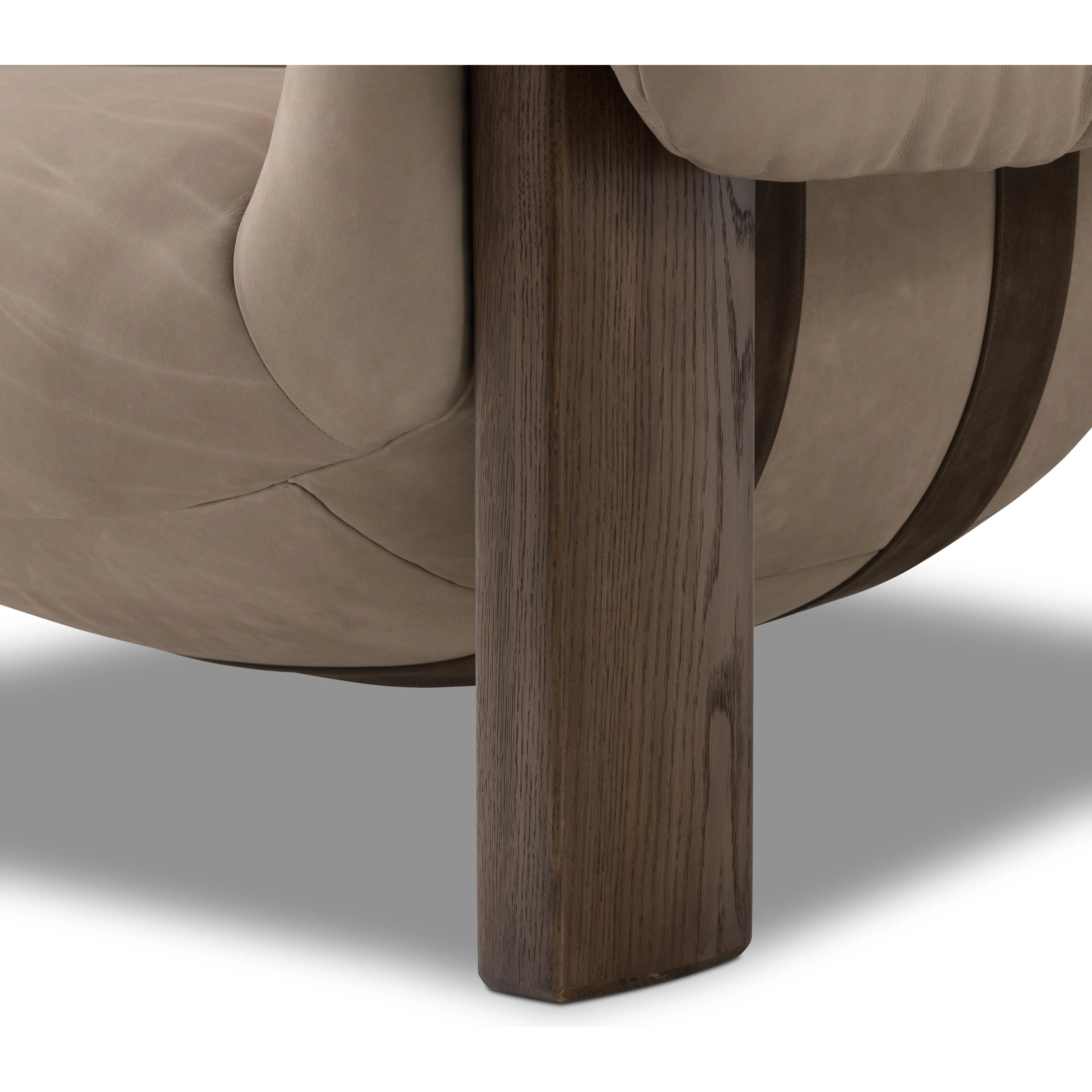 Featuring Samena Nubuck Sand Chair by Four Hands at Amethyst Home. A cozy spot for lounging and curling up with a good book. This statement-making chair features large overflowing cushioning that wraps around the arms and back. Designed with S spring construction and a solid oak frame. Upholstered in a smooth sueded leather with contrasting sling seating st. Amethyst Home provides interior design, new home construction design consulting, vintage area rugs, and lighting in the Calabasas metro area.