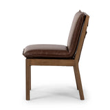 Featuring Wilmington Tan Oak Dining Chair by Four Hands at Amethyst Home. Inspired by the folded pillow form, the seat and back cushions of this oak dining chair are covered in brown top-grain leather. The chair back features leather strap details for a mixed material touch.Collection: AshfordColors: Tan Oak ,Havana BrownMaterials: Solid Oak ,Top Grain Leath. Amethyst Home provides interior design, new home construction design consulting, vintage area rugs, and lighting in the Monterey metro area.