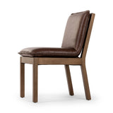 Featuring Wilmington Tan Oak Dining Chair by Four Hands at Amethyst Home. Inspired by the folded pillow form, the seat and back cushions of this oak dining chair are covered in brown top-grain leather. The chair back features leather strap details for a mixed material touch.Collection: AshfordColors: Tan Oak ,Havana BrownMaterials: Solid Oak ,Top Grain Lea. Amethyst Home provides interior design, new home construction design consulting, vintage area rugs, and lighting in the Scottsdale metro area.