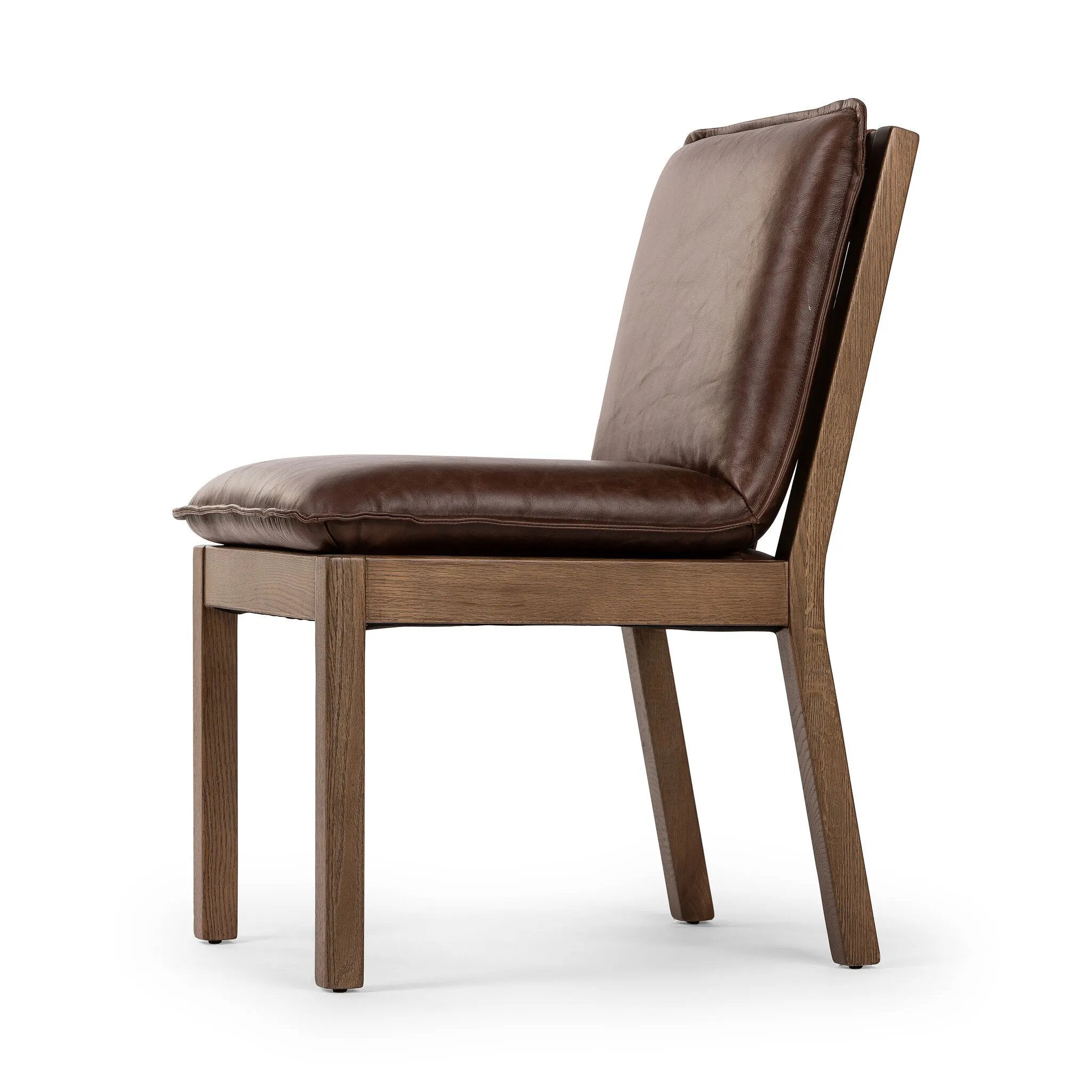 Featuring Wilmington Tan Oak Dining Chair by Four Hands at Amethyst Home. Inspired by the folded pillow form, the seat and back cushions of this oak dining chair are covered in brown top-grain leather. The chair back features leather strap details for a mixed material touch.Collection: AshfordColors: Tan Oak ,Havana BrownMaterials: Solid Oak ,Top Grain Lea. Amethyst Home provides interior design, new home construction design consulting, vintage area rugs, and lighting in the Scottsdale metro area.