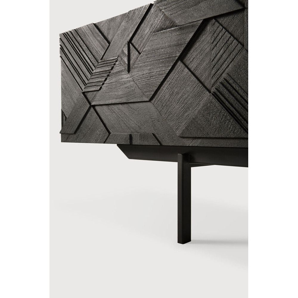 Featuring Graphic TV Cupboard by Ethnicraft at Amethyst Home. In his quest to add movement to the surface, our designer Alain van Havre started layering and combining triangular shapes. Before he knew it, he had created an interesting composition out of teak. Originally used for our popular Teak Graphic sideboard, the pattern now translates perfectly to a new TV cupboard.
This Graphic T. Amethyst Home provides interior design services, furniture, rugs, and lighting in the New York City metro area.