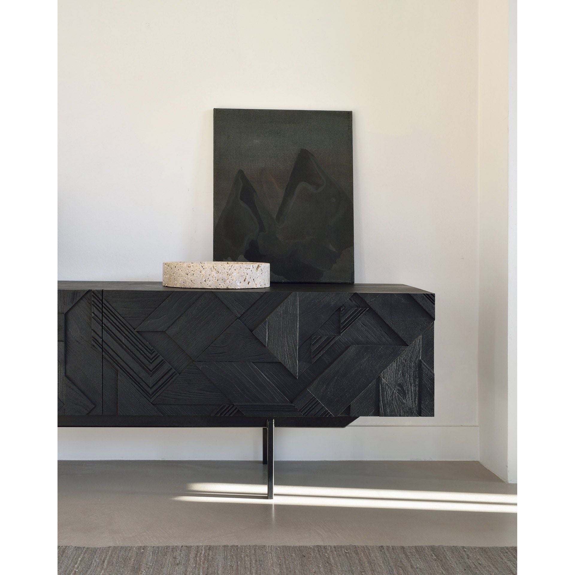 Featuring Graphic TV Cupboard by Ethnicraft at Amethyst Home. In his quest to add movement to the surface, our designer Alain van Havre started layering and combining triangular shapes. Before he knew it, he had created an interesting composition out of teak. Originally used for our popular Teak Graphic sideboard, the pattern now translates perfectly to a new TV cupboard.
This Graphic TV cupboa. Amethyst Home provides interior design services, furniture, rugs, and lighting in the Tampa metro area.
