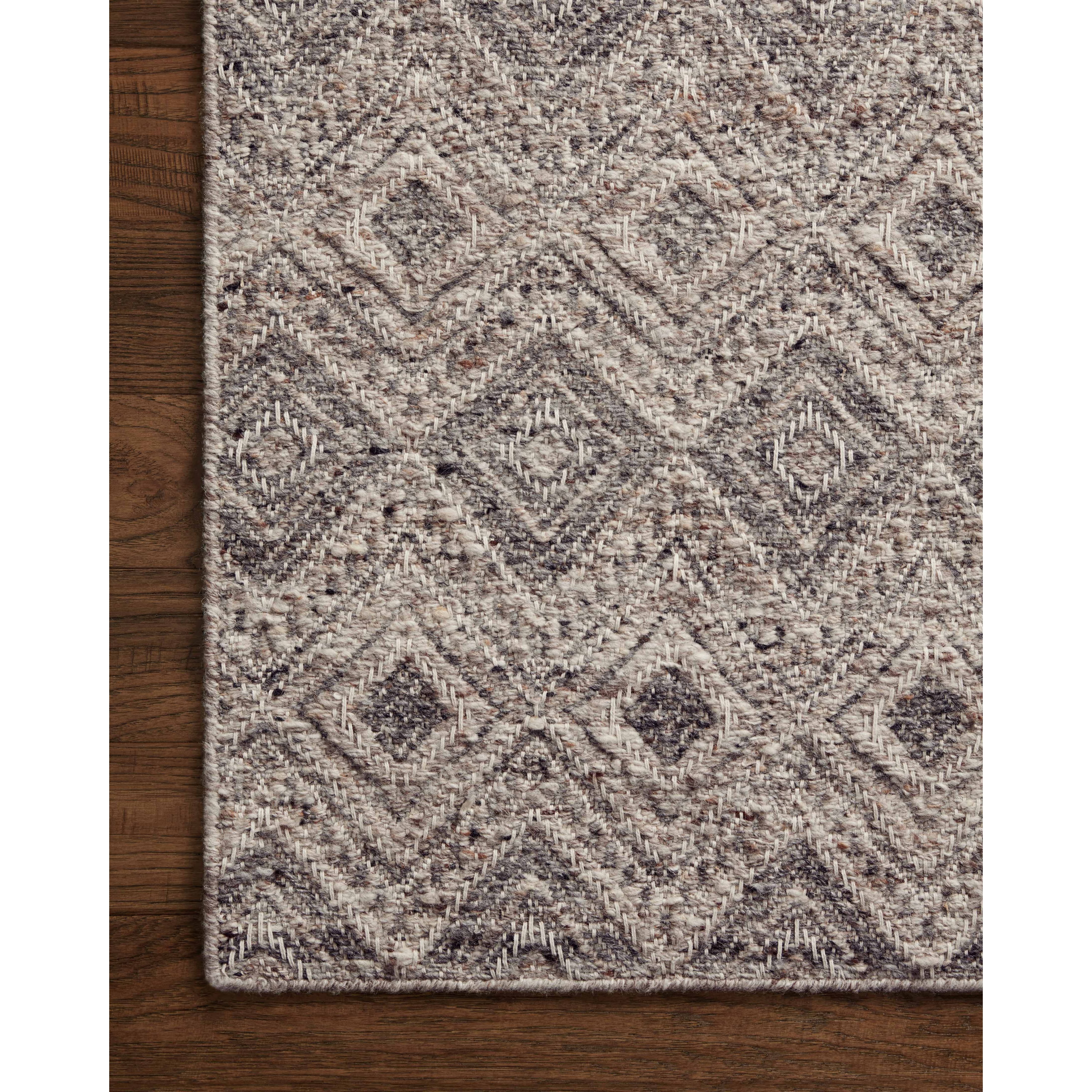 Featuring Raven Taupe / Grey Rug by Loloi at Amethyst Home. The Raven Taupe / Grey Rug is intricately handwoven with delicate, fine yarns that amplify the rug's layered and dimensional geometric design. While the rug itself is thick and sturdy, the colors and patterns have a casual lightness that can work in many spaces, from busy living rooms to serene bedrooms. The Raven Taupe. Amethyst Home provides interior design, new construction, custom furniture, and area rugs in the Alpharetta metro area.
