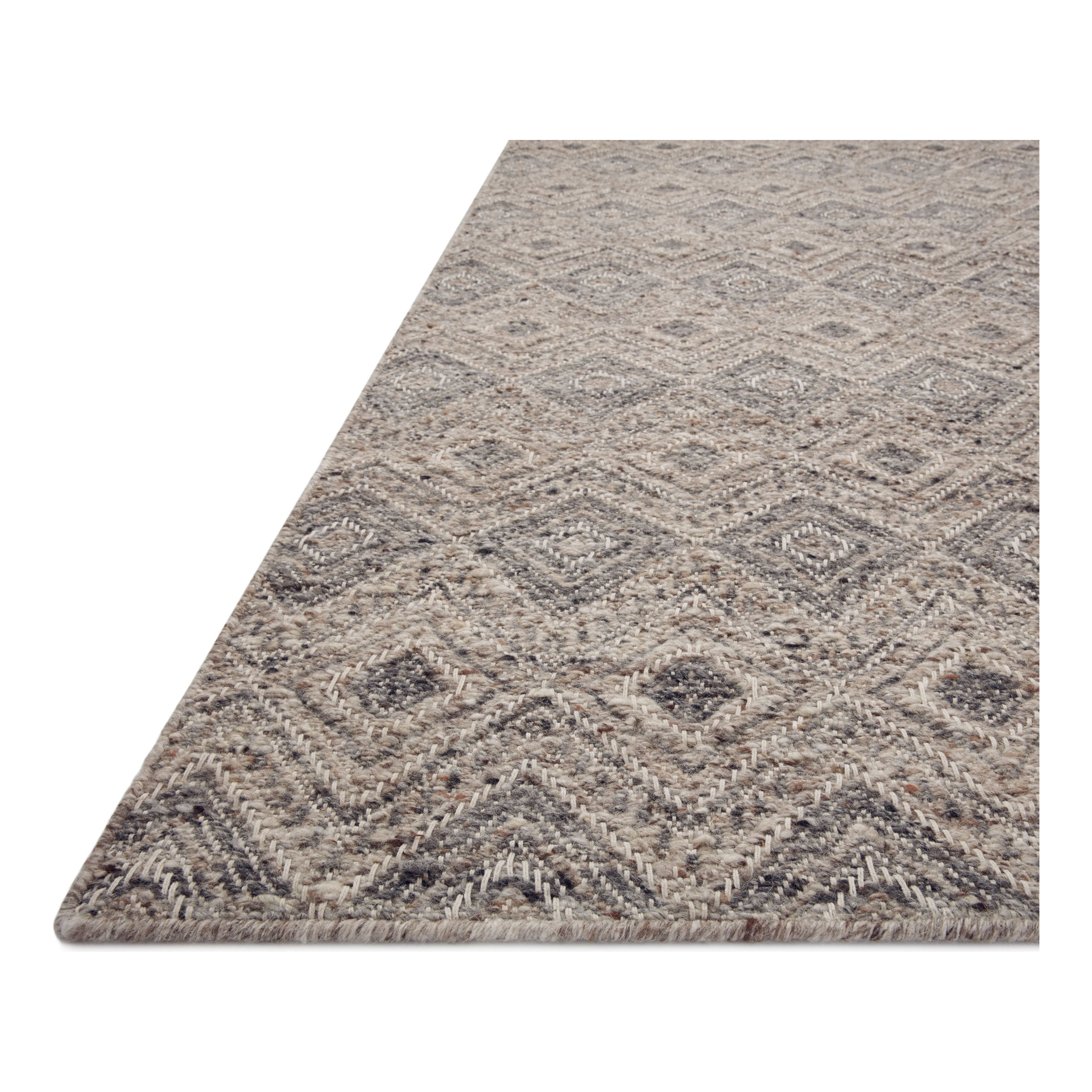 Featuring Raven Taupe / Grey Rug by Loloi at Amethyst Home. The Raven Taupe / Grey Rug is intricately handwoven with delicate, fine yarns that amplify the rug's layered and dimensional geometric design. While the rug itself is thick and sturdy, the colors and patterns have a casual lightness that can work in many spaces, from busy living rooms to serene bedrooms. The Raven Taupe. Amethyst Home provides interior design, new construction, custom furniture, and area rugs in the Scottsdale metro area.