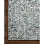 Featuring Raven Blue / Ivory Rug by Loloi at Amethyst Home. The Raven Blue / Ivory Rug is intricately handwoven with delicate, fine yarns that amplify the rug's layered and dimensional geometric design. While the rug itself is thick and sturdy, the colors and patterns have a casual lightness that can work in many spaces, from busy living rooms to serene bedrooms. The Raven Blue . Amethyst Home provides interior design, new construction, custom furniture, and area rugs in the Washington metro area.