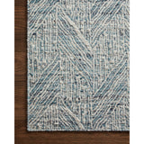 Featuring Raven Blue / Ivory Rug by Loloi at Amethyst Home. The Raven Blue / Ivory Rug is intricately handwoven with delicate, fine yarns that amplify the rug's layered and dimensional geometric design. While the rug itself is thick and sturdy, the colors and patterns have a casual lightness that can work in many spaces, from busy living rooms to serene bedrooms. The Raven Blue . Amethyst Home provides interior design, new construction, custom furniture, and area rugs in the Washington metro area.