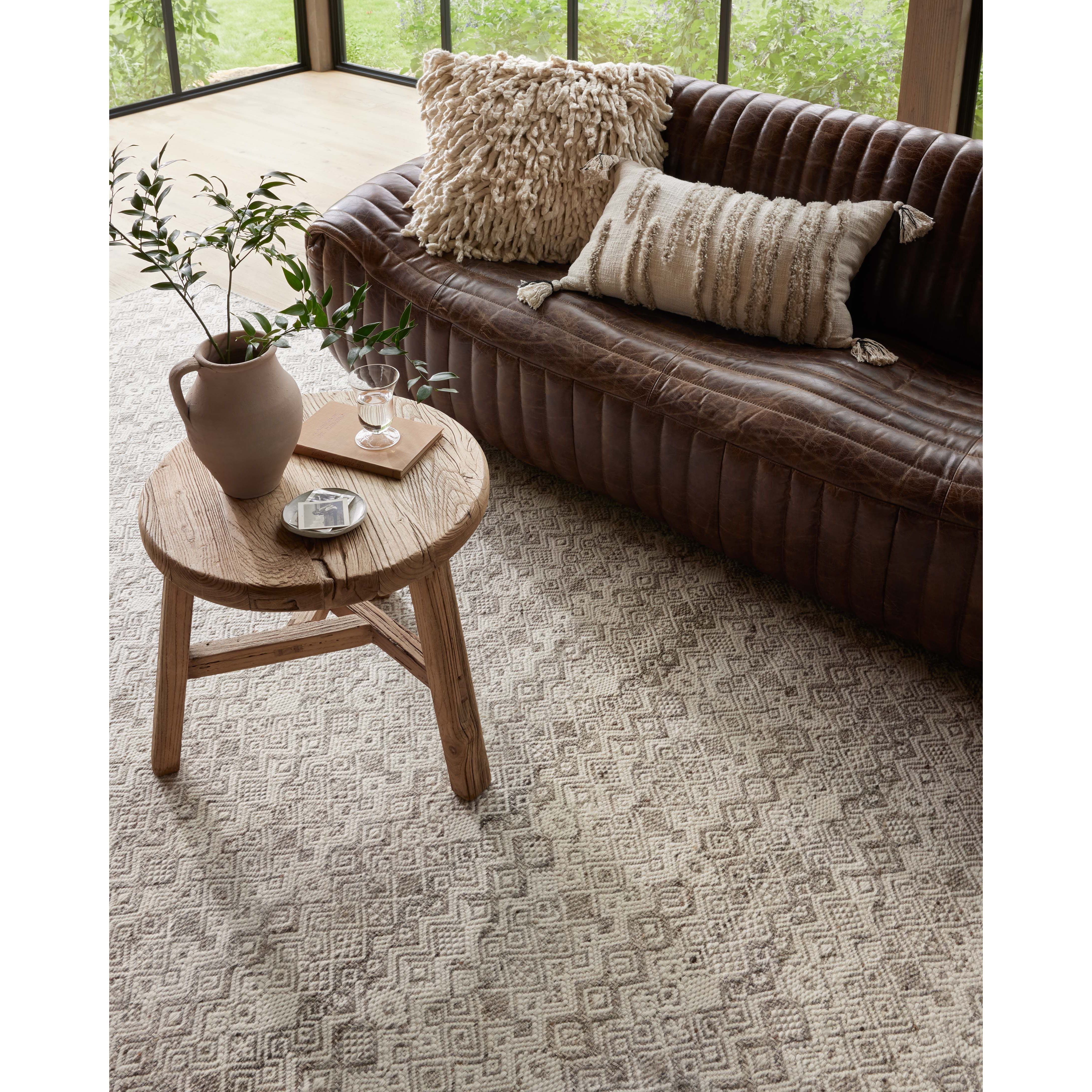 Featuring Raven Dove / Ivory Rug by Loloi at Amethyst Home. The Raven Dove / Ivory Rug is intricately handwoven with delicate, fine yarns that amplify the rug's layered and dimensional geometric design. While the rug itself is thick and sturdy, the colors and patterns have a casual lightness that can work in many spaces, from busy living rooms to serene bedrooms. The Raven Dove / Iv. Amethyst Home provides interior design, new construction, custom furniture, and area rugs in the Austin metro area.