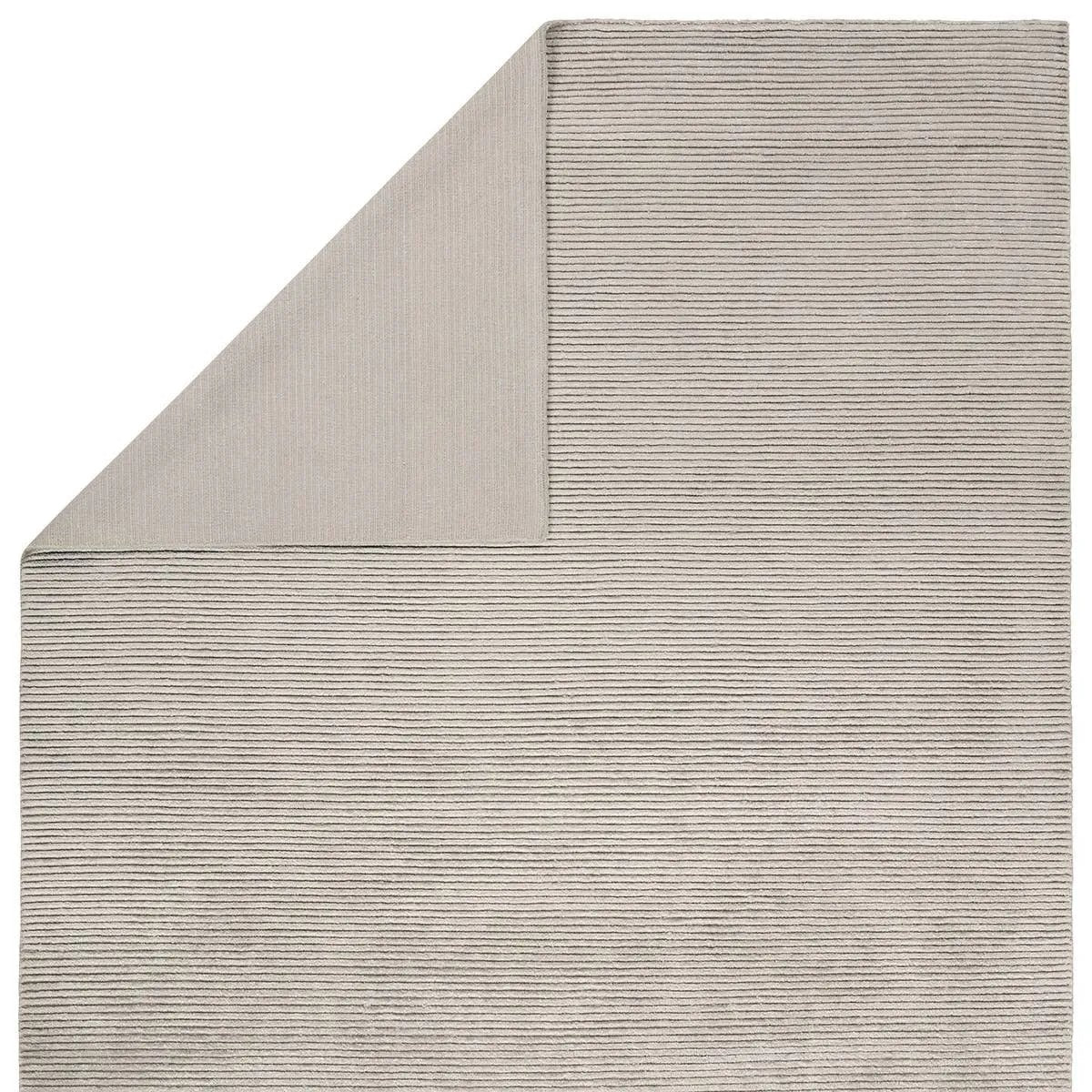 Featuring Aion Atropos Hand-Knotted Rug by Jaipur Living at Amethyst Home. Indulge in the epitome of luxe with the Aion Atropos, where the extraordinary softness of Cashmere meets the enduring durability of New Zealand Wool. Crafted to redefine the essence of sophistication, the silver Tibetan knotted Atropos design emerges as the unparalleled centerpiece in l. Amethyst Home provides interior design, new home construction design consulting, vintage area rugs, and lighting in the Austin metro area.