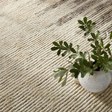 Featuring Alpine Patra Hand-Knotted Rug by Jaipur Living at Amethyst Home. Inspired by textiles from the Tullu region in Morocco, the Patra area rug showcases a linear design in neutral shades of cream, taupe, brown, and gray. This high-piled accent lends warmth and comfort to any space with durable wool hand-knotted onto a cotton foundation. Braided fri. Amethyst Home provides interior design, new home construction design consulting, vintage area rugs, and lighting in the Laguna Beach metro area.