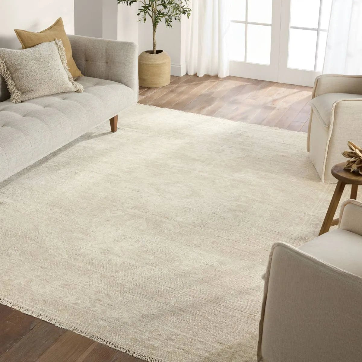 Featuring Ashend Vavite Hand-Knotted Rug by Jaipur Living at Amethyst Home. Hand carded wool, soft Tencel, and a neutral color palette define the handknotted Ashend Vavite. The Vavite rug showcases a Moroccan-inspired center medallion in a neutral cream and tan colorway. Geometric detailing establishes a thin border and provides a nod to the tribal style. Amethyst Home provides interior design, new home construction design consulting, vintage area rugs, and lighting in the Laguna Beach metro area.