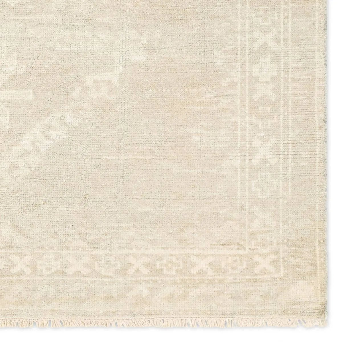 Featuring Ashend Vavite Hand-Knotted Rug by Jaipur Living at Amethyst Home. Hand carded wool, soft Tencel, and a neutral color palette define the handknotted Ashend Vavite. The Vavite rug showcases a Moroccan-inspired center medallion in a neutral cream and tan colorway. Geometric detailing establishes a thin border and provides a nod to the tribal styles. Amethyst Home provides interior design, new home construction design consulting, vintage area rugs, and lighting in the Los Angeles metro area.