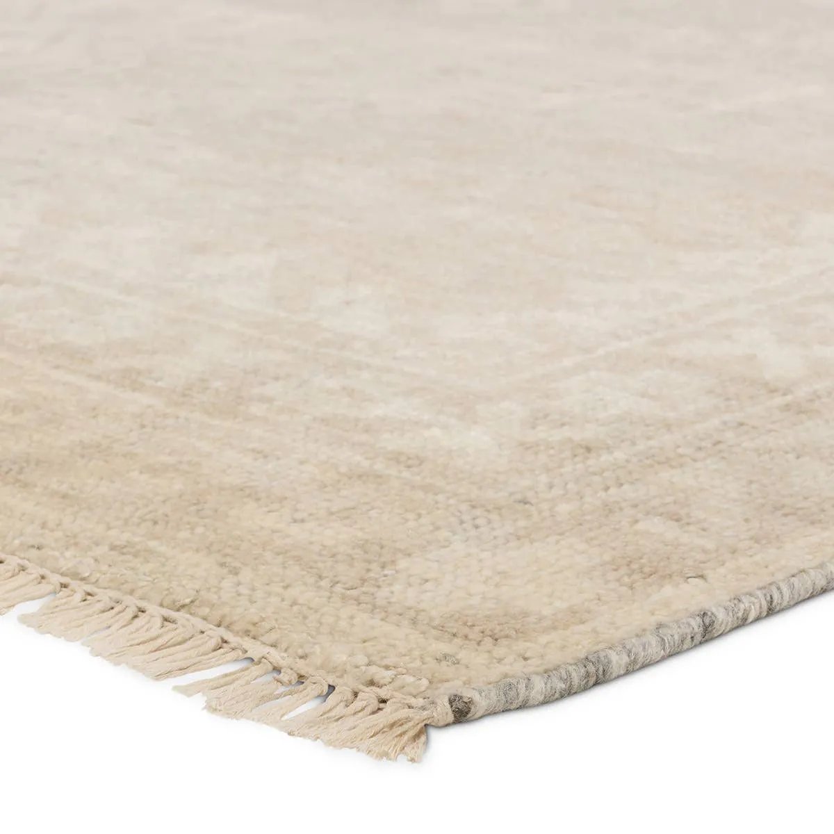 Featuring Ashend Vavite Hand-Knotted Rug by Jaipur Living at Amethyst Home. Hand carded wool, soft Tencel, and a neutral color palette define the handknotted Ashend Vavite. The Vavite rug showcases a Moroccan-inspired center medallion in a neutral cream and tan colorway. Geometric detailing establishes a thin border and provides a nod to the tribal styles o. Amethyst Home provides interior design, new home construction design consulting, vintage area rugs, and lighting in the San Diego metro area.