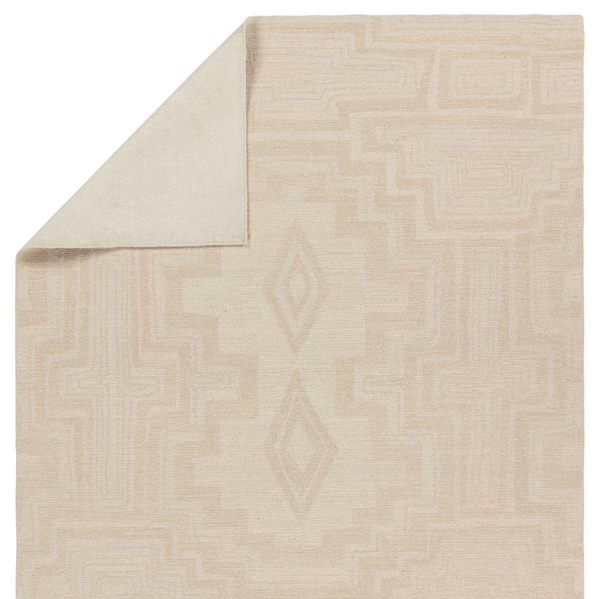 Featuring Cardamom Aterian Rug by Jaipur Living at Amethyst Home. The hand-tufted Cardamom Aterian boasts vivid jewel tones and uniquely distressed Turkish motifs, crafted to emulate traditional sun-faded, vintage designs. The Aterian rug showcases an open medallion and geometric motif in a natural palette of light gray and cream. Inspired by the artistic i. Amethyst Home provides interior design, new home construction design consulting, vintage area rugs, and lighting in the Calabasas metro area.