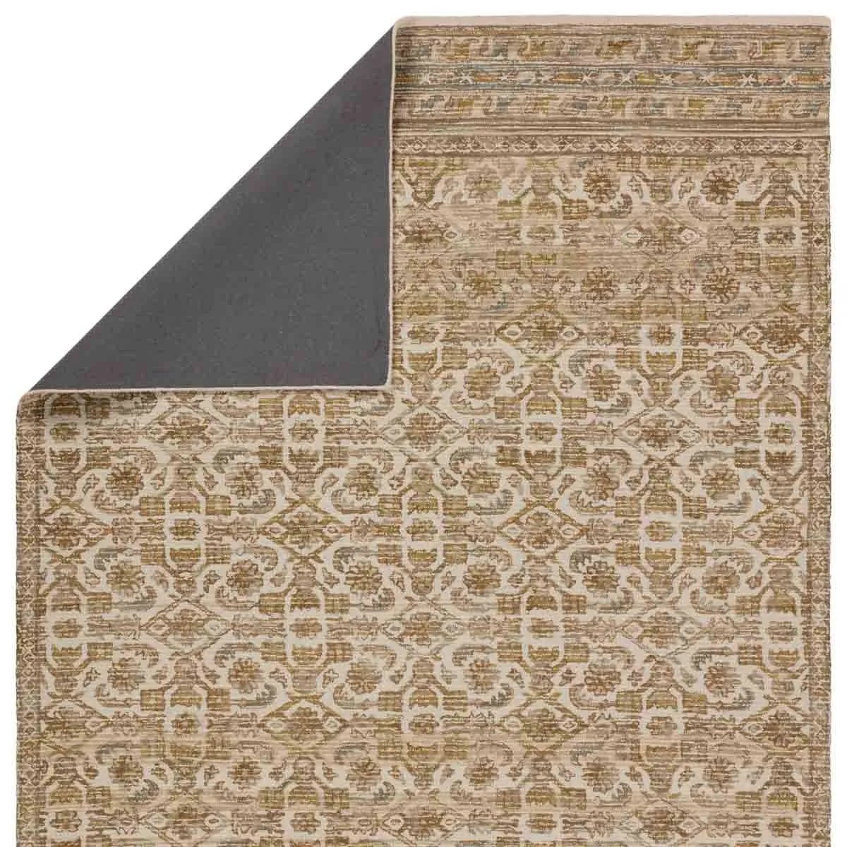 Featuring Cardamom Sarang Rug by Jaipur Living at Amethyst Home. The hand-tufted Cardamom Sarang boasts vivid jewel tones and uniquely distressed Turkish motifs, crafted to emulate traditional sun-faded, vintage designs. The Sarang rug showcases a floral trellis motif in a mix of warm and earthy hues including brown, gold, cream, beige, and hints of blu. Amethyst Home provides interior design, new home construction design consulting, vintage area rugs, and lighting in the Newport Beach metro area.