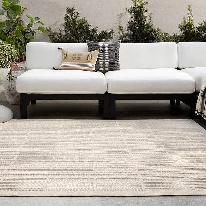 Featuring Continuum Quantum Rug by Jaipur Living at Amethyst Home. The Continuum collection brings the classic sisal look to outdoor spaces and high-traffic indoor areas. The soft Axiom design features an abstract, geometric pattern with cream high-low pile for added dimension. The polypropylene fibers are stain and water resistant for an easy-care accent piece. Amethyst Home provides interior design, new home construction design consulting, vintage area rugs, and lighting in the Tampa metro area.