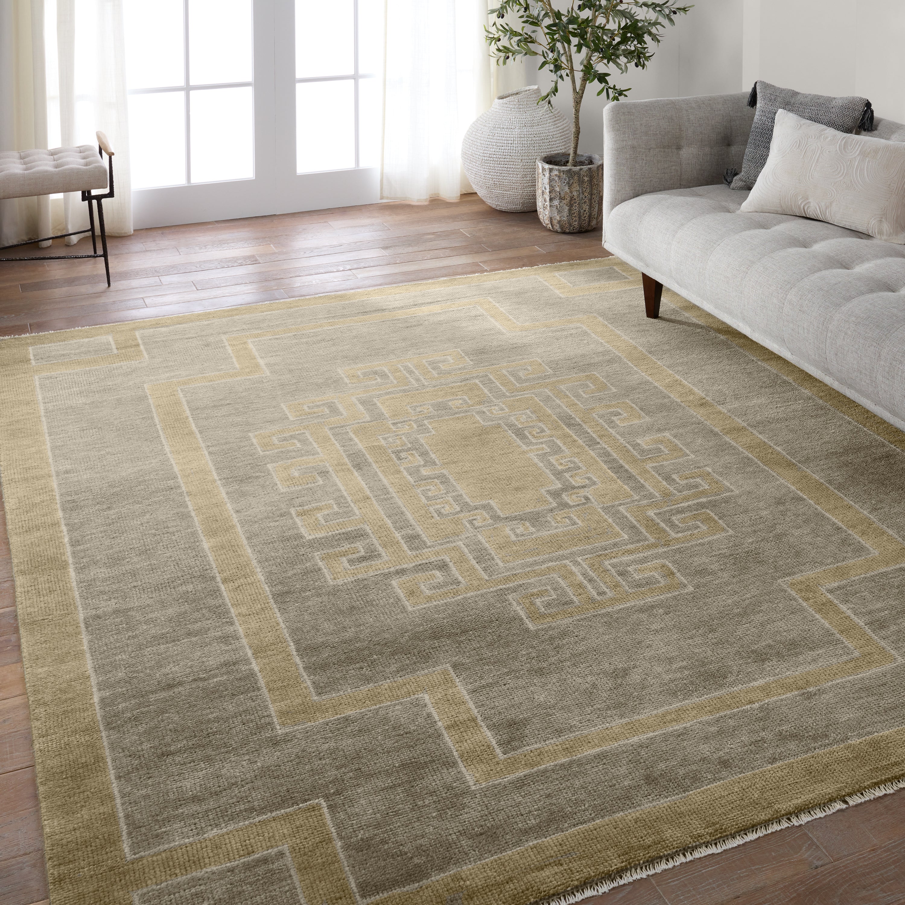 Featuring Cyprus Gray Kyrenia Hand-Knotted Rug by Jaipur Living at Amethyst Home. The hand-knotted Cyprus collection showcases a modern representation of vintage Kars designs with clean-lined geometric details and fresh colorways. The gray, sage, and cream Kyrenia design delights with an antique medallion pattern and a similarly styled border. Low pile and naturally stain resistant . Amethyst Home provides interior design, new construction, custom furniture, and area rugs in the Austin metro area.