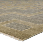 Featuring Cyprus Gray Kyrenia Hand-Knotted Rug by Jaipur Living at Amethyst Home. The hand-knotted Cyprus collection showcases a modern representation of vintage Kars designs with clean-lined geometric details and fresh colorways. The gray, sage, and cream Kyrenia design delights with an antique medallion pattern and a similarly styled border. Low pile and naturally stain resistant f. Amethyst Home provides interior design, new construction, custom furniture, and area rugs in the Omaha metro area.