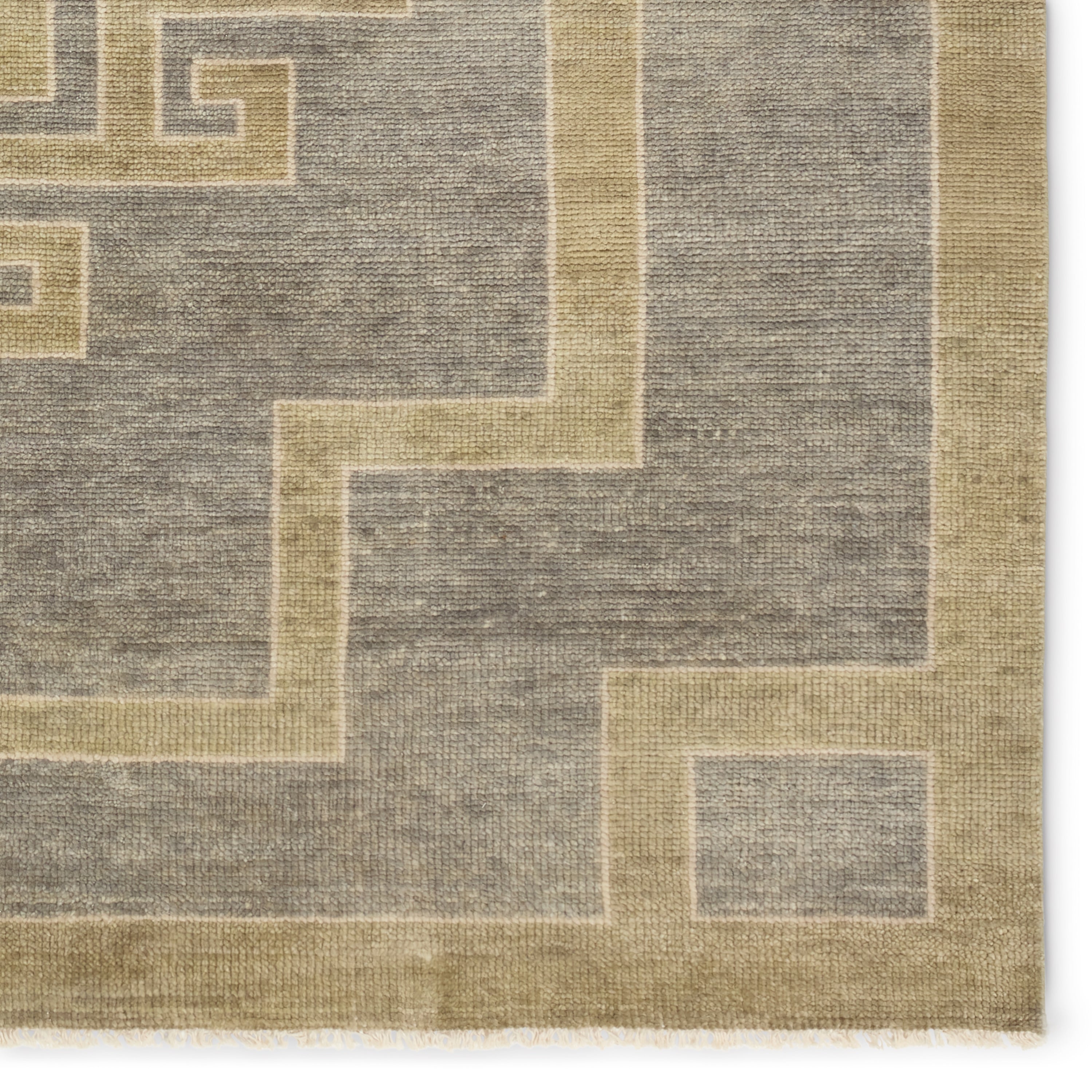 Featuring Cyprus Gray Kyrenia Hand-Knotted Rug by Jaipur Living at Amethyst Home. The hand-knotted Cyprus collection showcases a modern representation of vintage Kars designs with clean-lined geometric details and fresh colorways. The gray, sage, and cream Kyrenia design delights with an antique medallion pattern and a similarly styled border. Low pile and naturally stain resist. Amethyst Home provides interior design, new construction, custom furniture, and area rugs in the Scottsdale metro area.