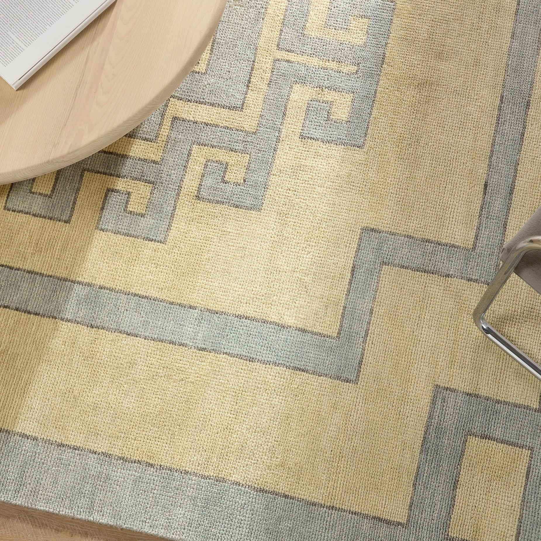 Featuring Cyprus Nicosia Asparagus Hand-Knotted Rug by Jaipur Living at Amethyst Home. The hand-knotted Cyprus collection showcases a modern representation of vintage Kars designs with clean-lined geometric details and fresh colorways. The blue, cream, gray, and caramel colored Nicosia design delights with a minimalistic medallion pattern and multiple borders. Low pile and na. Amethyst Home provides interior design, new construction, custom furniture, and area rugs in the Newport Beach metro area.