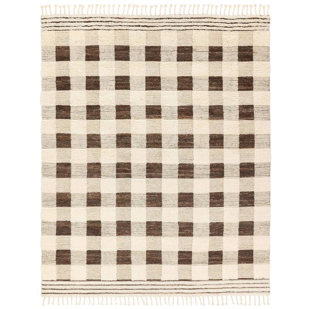 Featuring Desouk Berkshire Hand-Knotted Rug by Jaipur Living at Amethyst Home. The Desouk Berkshire melds modern allure with the global vibes of Morocco. The Berkshire hand-knotted rug showcases a geometric grid pattern with contrasting brown, cream, and tan tones. This handcrafted rug boasts plush, cut wool pile that pairs beautifully with braided tas. Amethyst Home provides interior design, new home construction design consulting, vintage area rugs, and lighting in the Salt Lake City metro area.