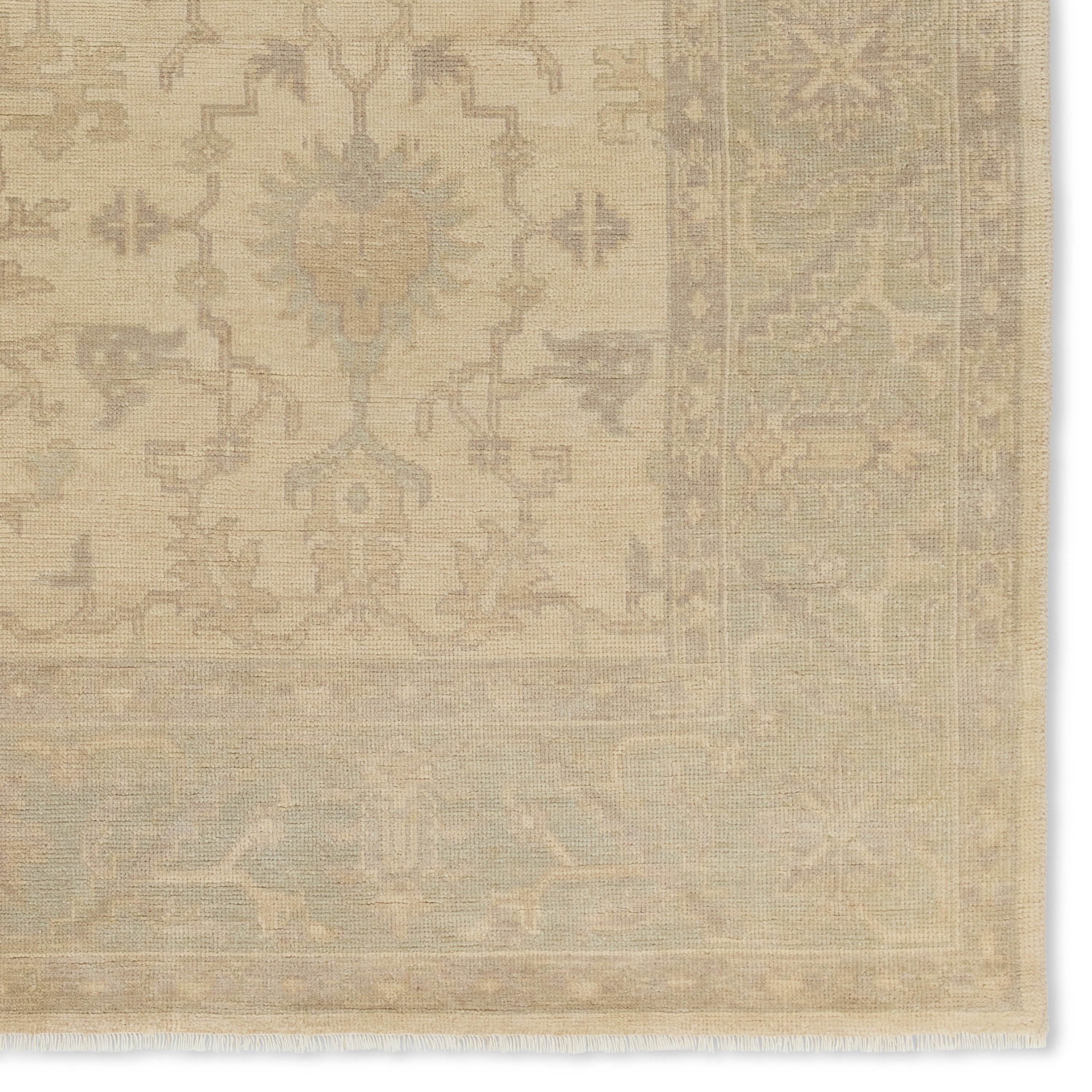 Featuring Eloquent Verity Natural Hand-Knotted Rug by Jaipur Living at Amethyst Home. The Eloquent collection emanates traditional elegance, lending a soft and serene look to transitional homes. The Verity area rug features a faded Oushak design in muted cream, light sage, and gray tones. This hand-knotted wool and viscose rug grounds living spaces with a classic, earthy look. Cr. Amethyst Home provides interior design, new construction, custom furniture, and area rugs in the Calabasas metro area.