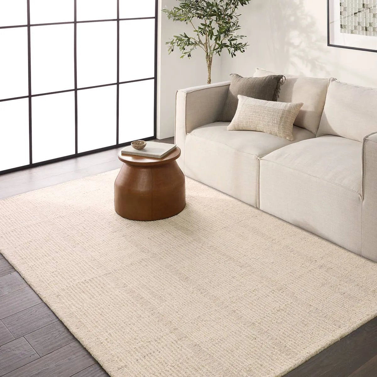 Featuring Finnigan Edher Rug by Jaipur Living at Amethyst Home. Handmade of 100% all-natural, undyed wool, the Edher rug enjoys an understated elegance that is satisfying in its simplicity. Rows of subtle organic stripes play across its field as delicate flecks of brown, accent the instinctive composition. As uncomplicated as it is extraordinary, it exudes a qu. Amethyst Home provides interior design, new home construction design consulting, vintage area rugs, and lighting in the Tampa metro area.