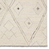 Featuring Hadi Ismael Rug by Jaipur Living at Amethyst Home. The hand-tufted Hadi Ismael introduces fresh looks inspired by modern Moroccan patterns and neutral colorways. The Ismael design features overlapping stripes in cream and gray hues. Short, gray fringe and 100% wool pile adds to the global appeal. This rug is naturally stain-resistant and works best i. Amethyst Home provides interior design, new home construction design consulting, vintage area rugs, and lighting in the Boston metro area.